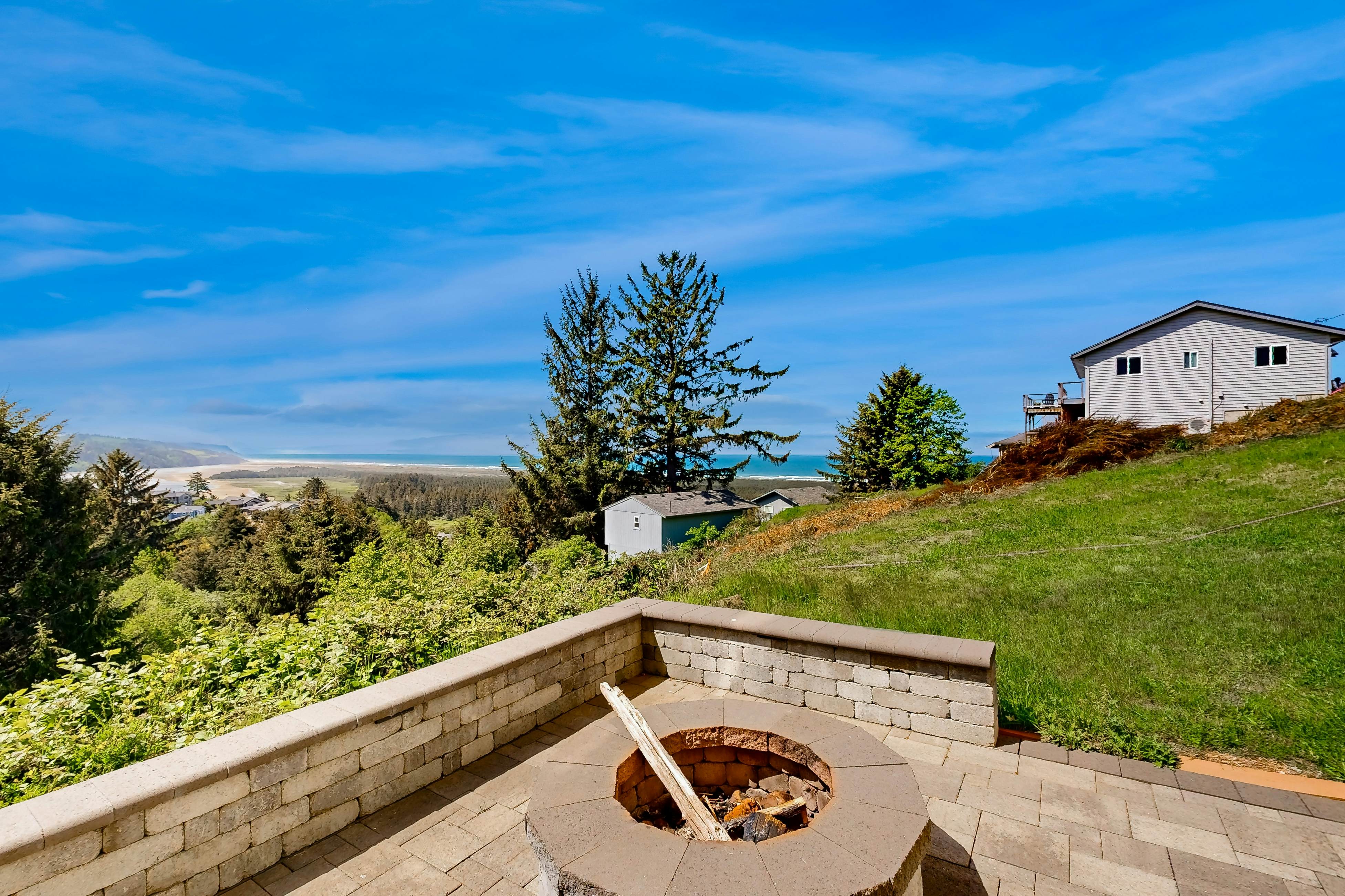 Ocean view home with heated floors, private hot tub, & multiple decks