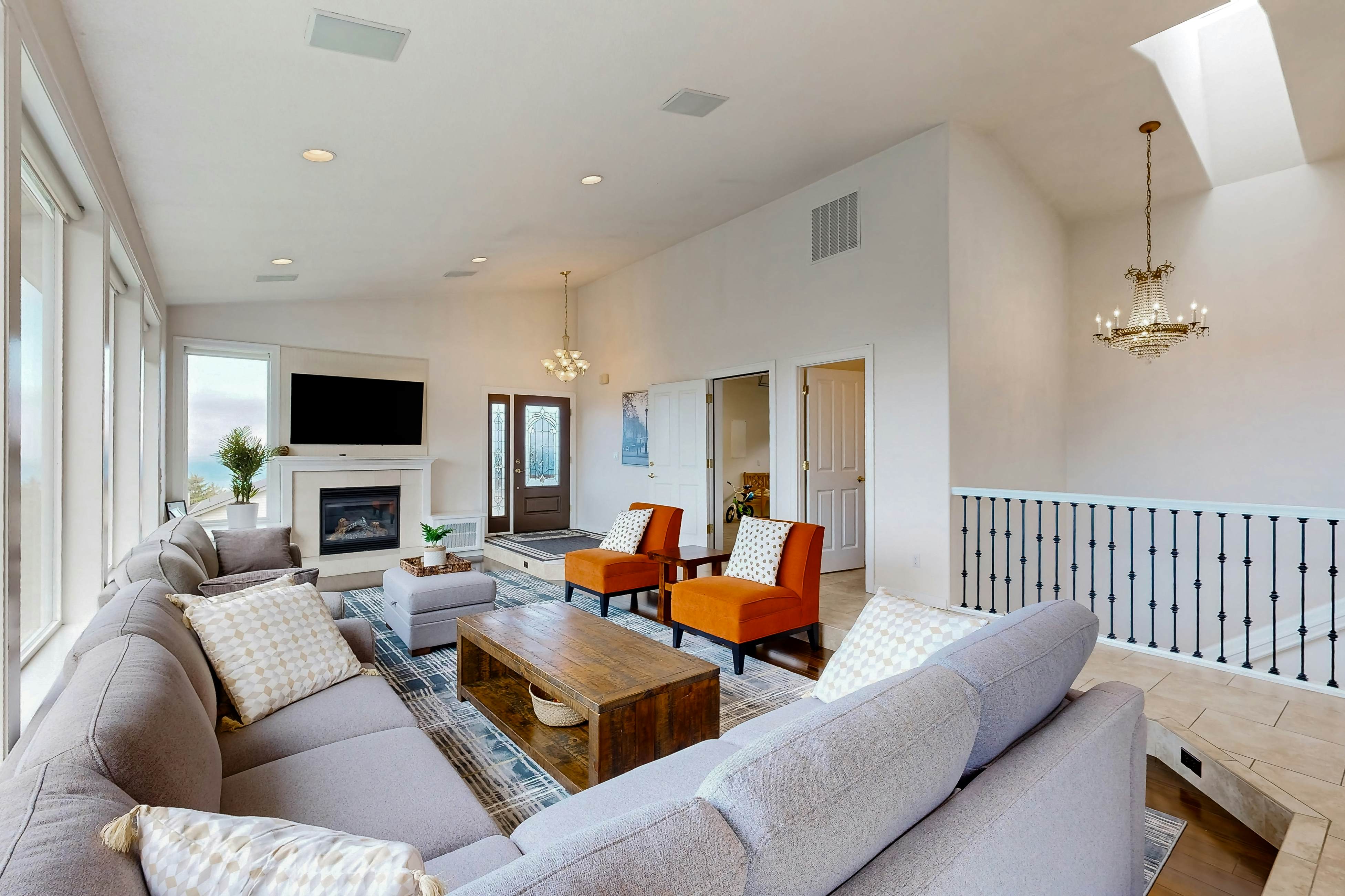 Ocean view home with heated floors, private hot tub, & multiple decks