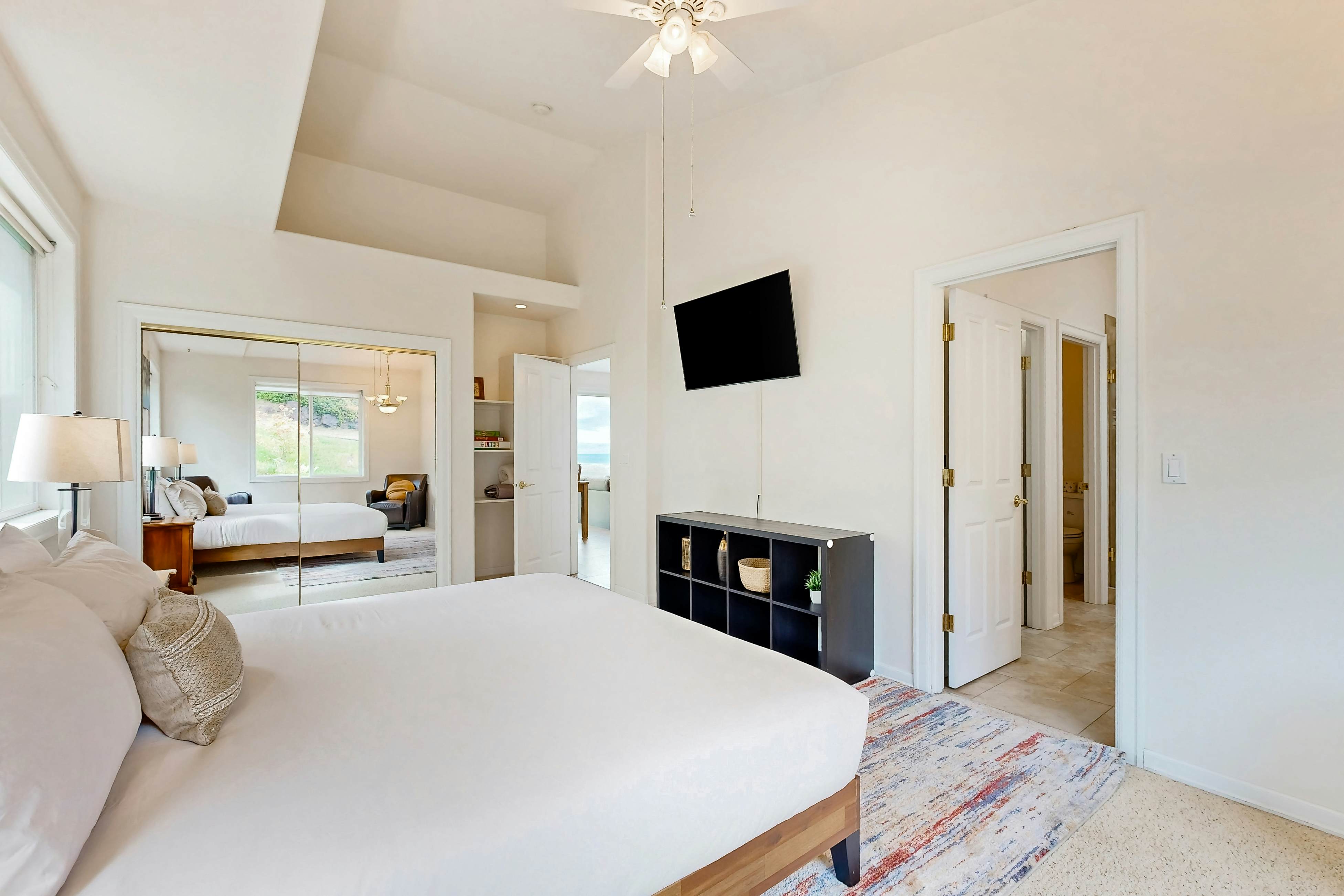 Ocean view home with heated floors, private hot tub, & multiple decks