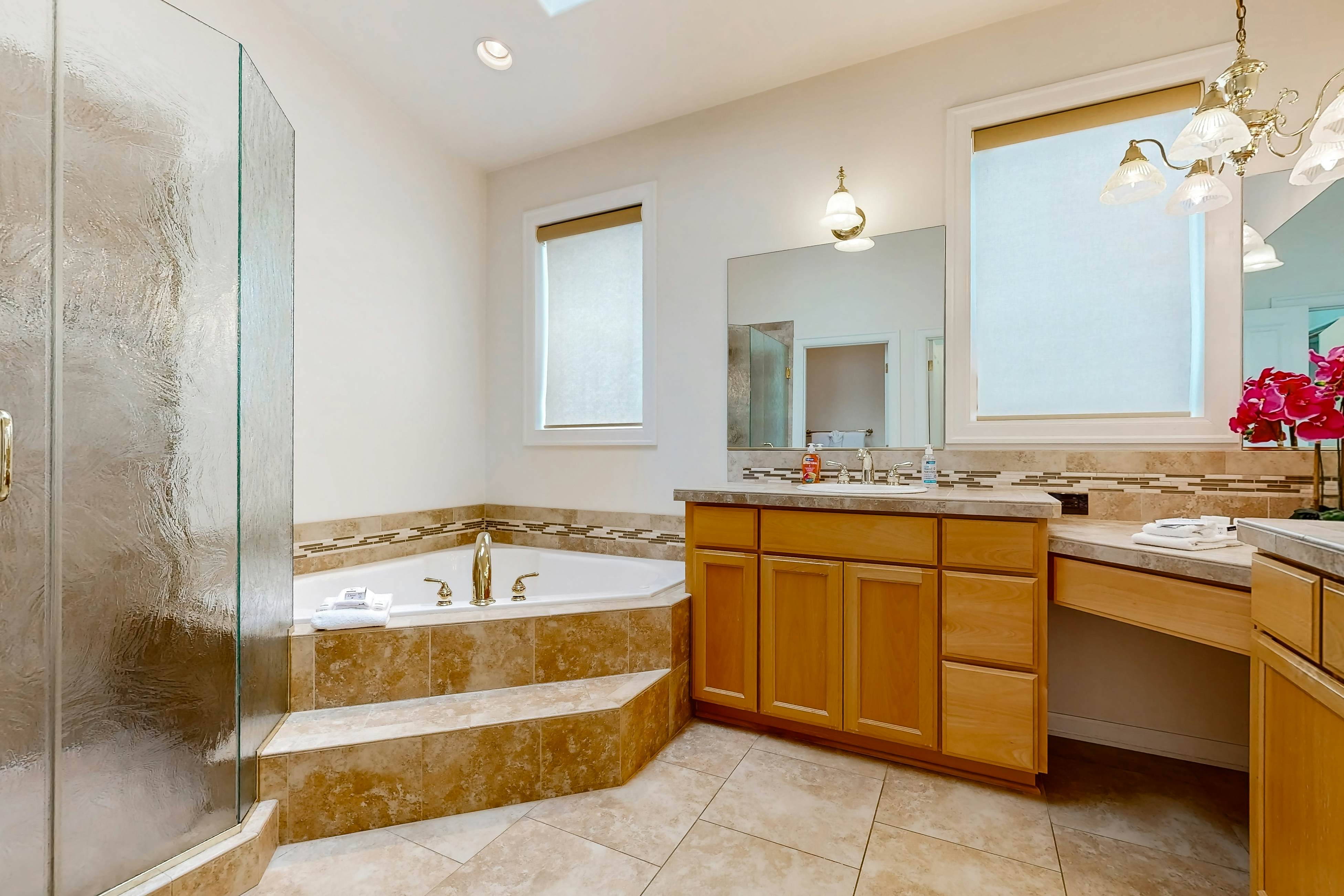 Ocean view home with heated floors, private hot tub, & multiple decks