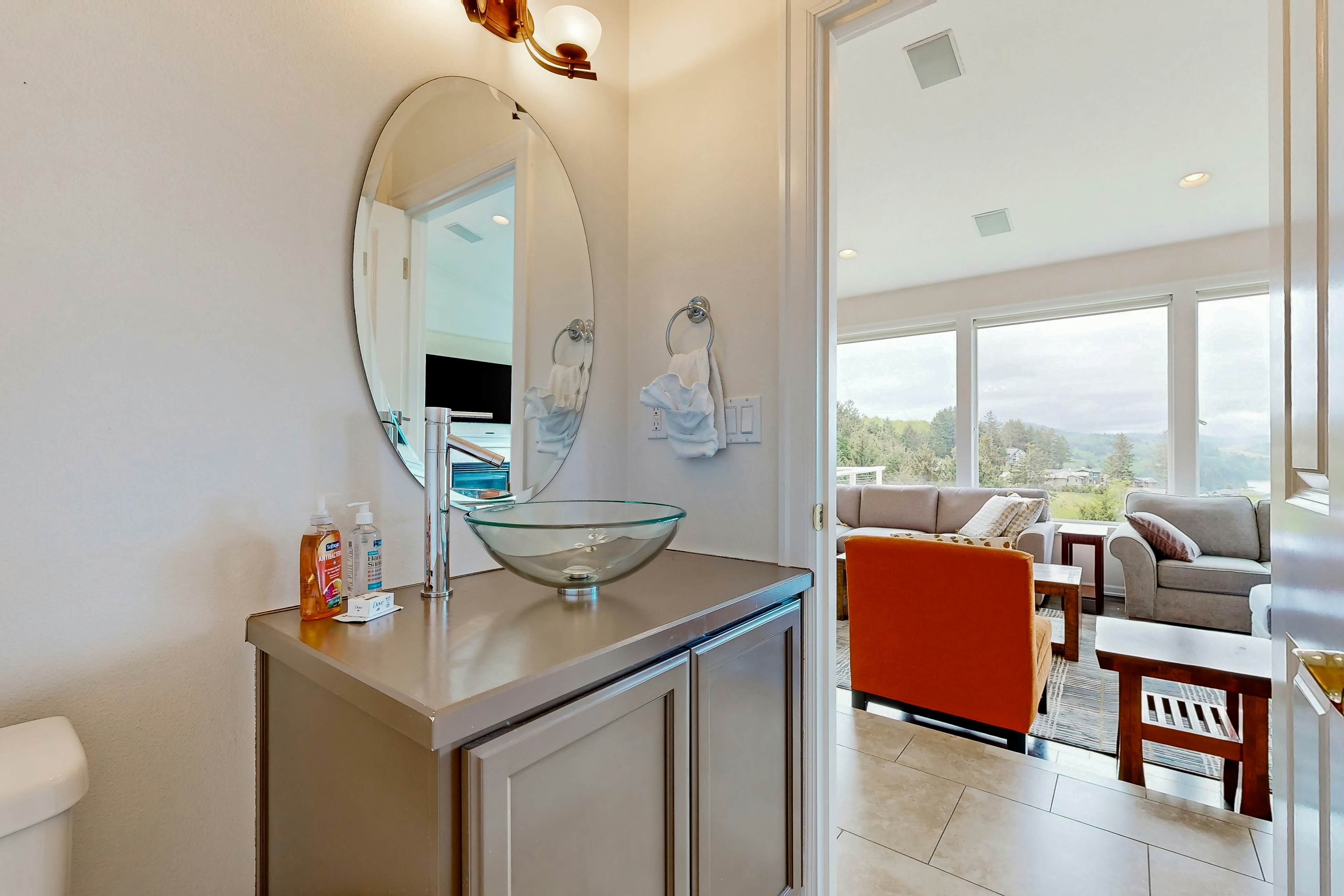 Ocean view home with heated floors, private hot tub, & multiple decks