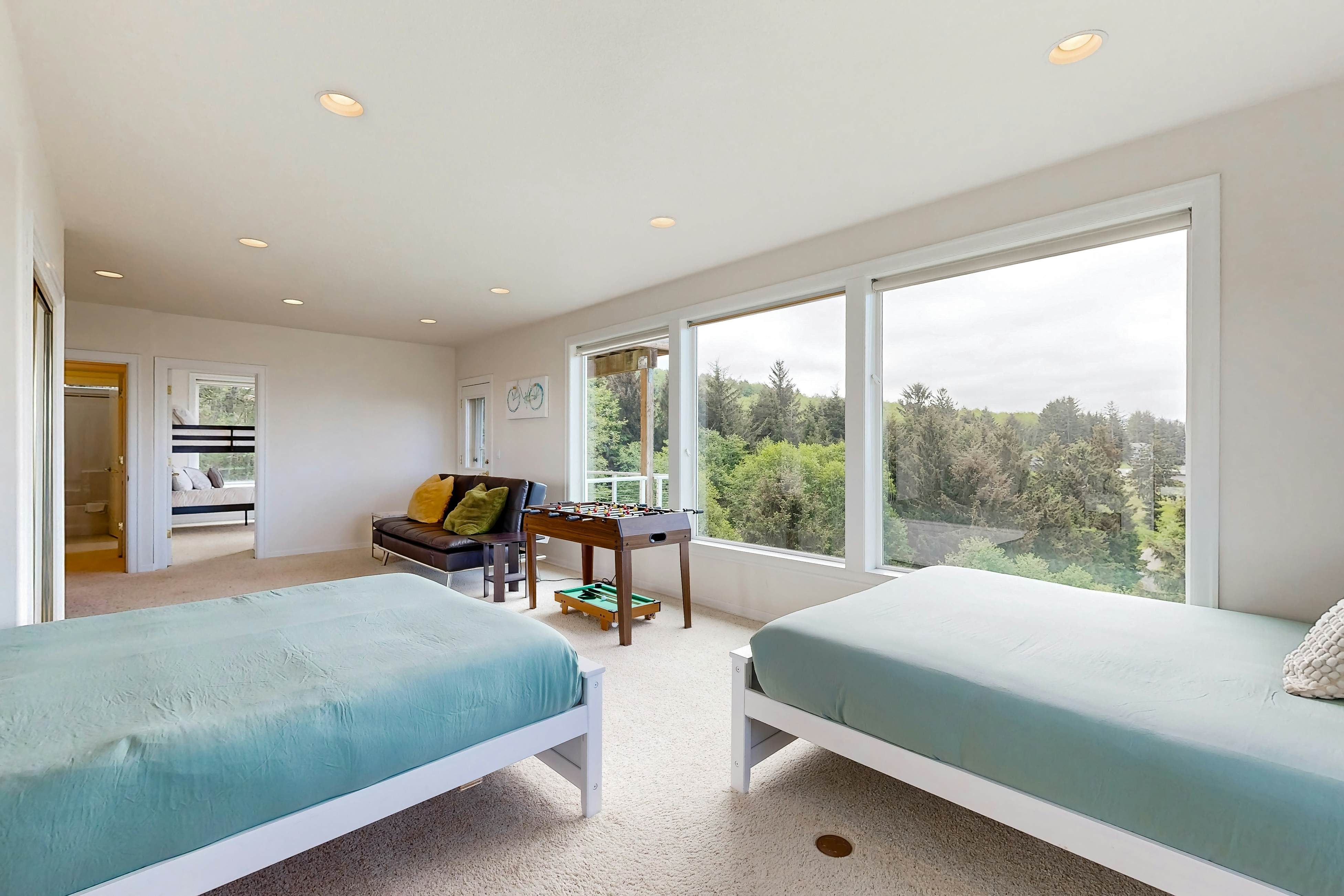 Ocean view home with heated floors, private hot tub, & multiple decks