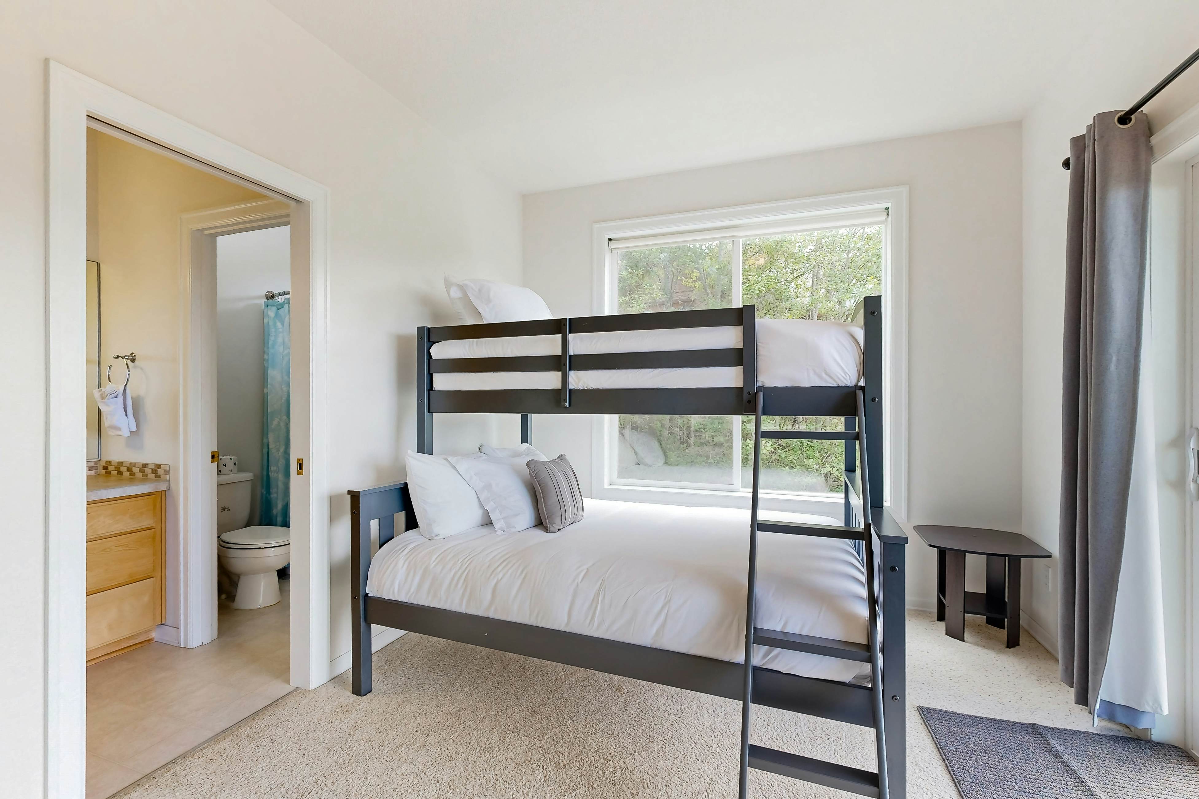 Ocean view home with heated floors, private hot tub, & multiple decks