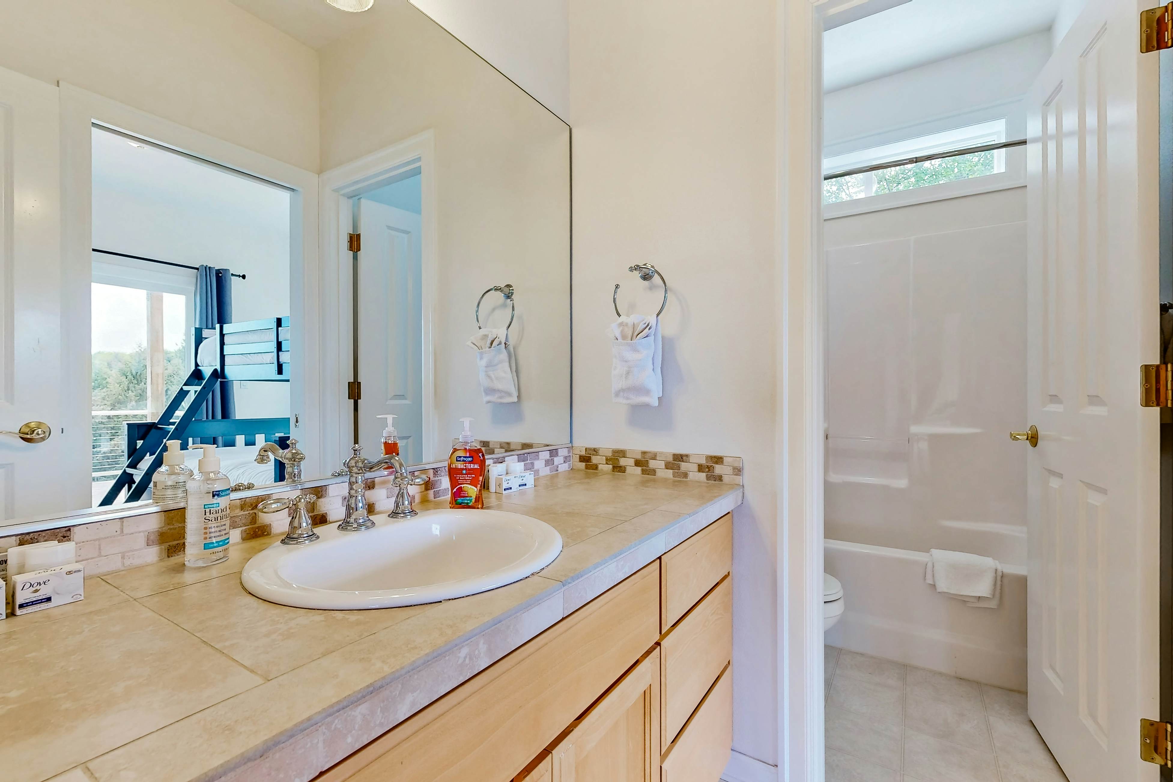 Ocean view home with heated floors, private hot tub, & multiple decks