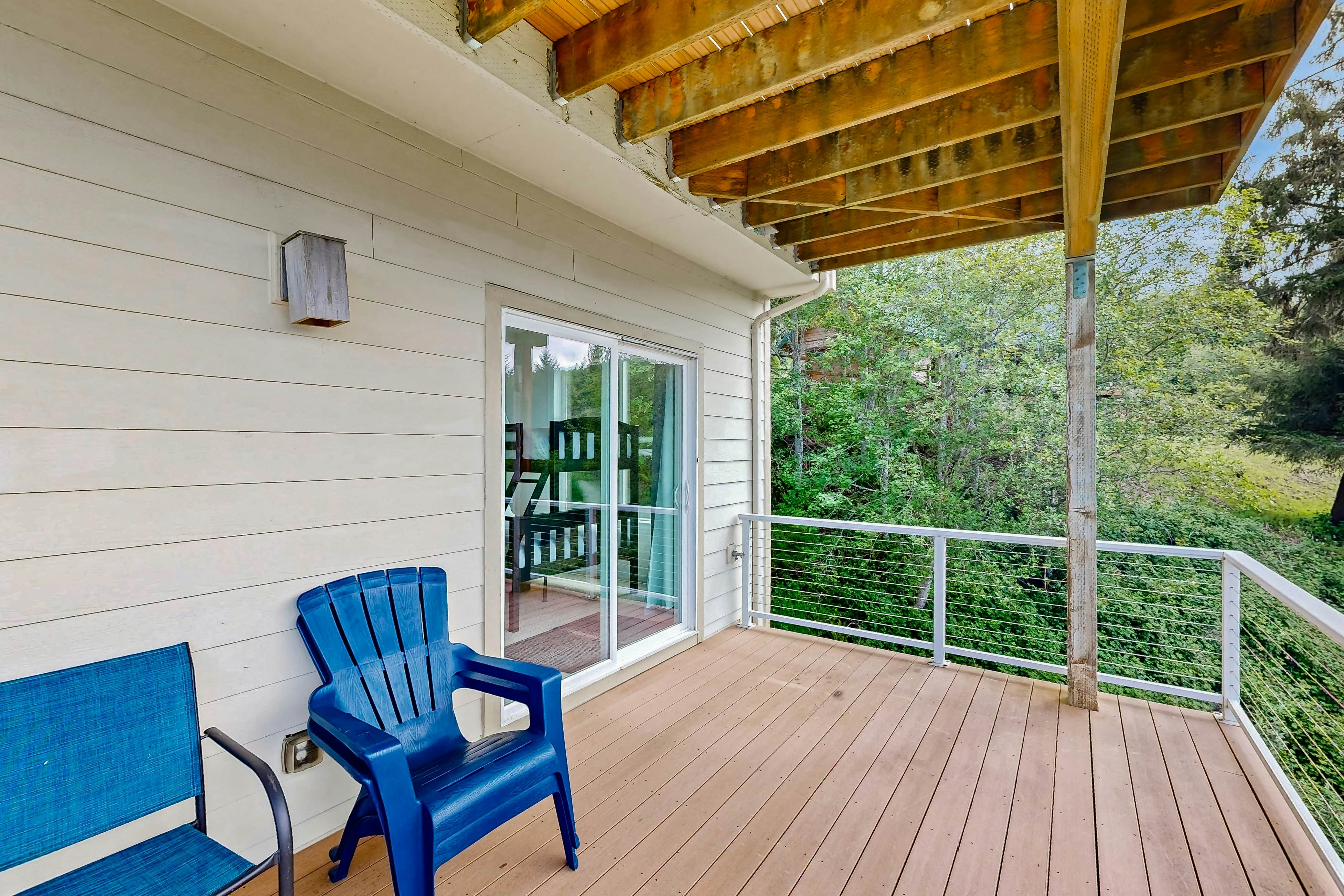 Ocean view home with heated floors, private hot tub, & multiple decks