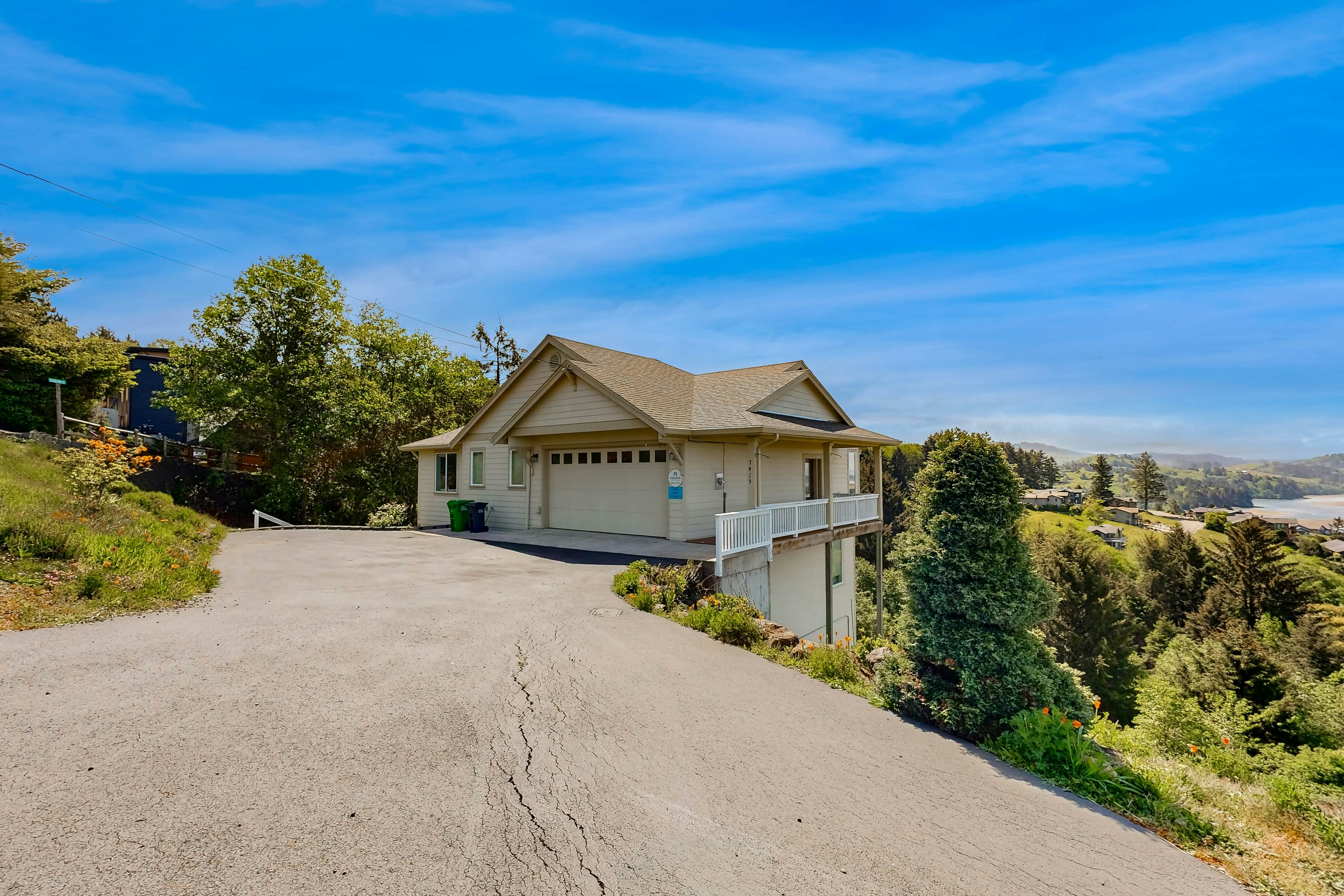 Ocean view home with heated floors, private hot tub, & multiple decks