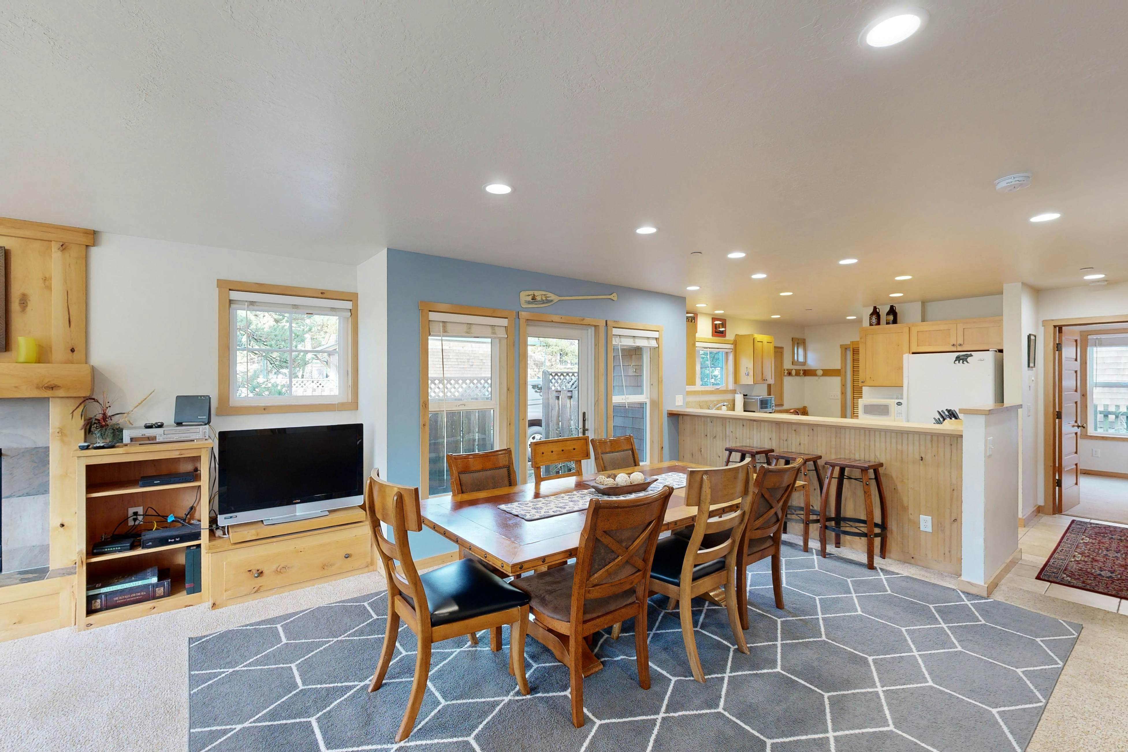 Coastal home walking distance to the beach with outdoor shower & fireplace