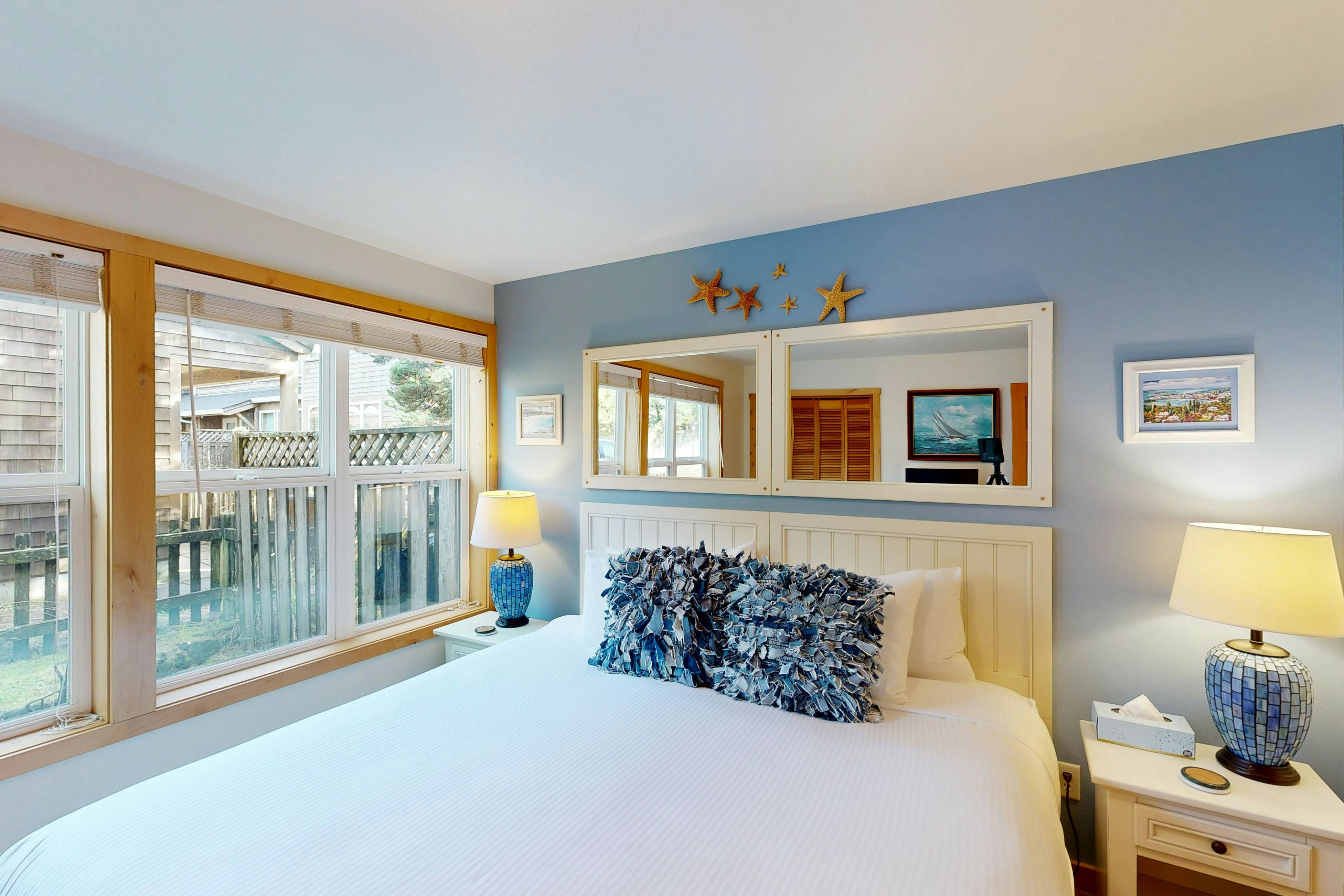 Coastal home walking distance to the beach with outdoor shower & fireplace