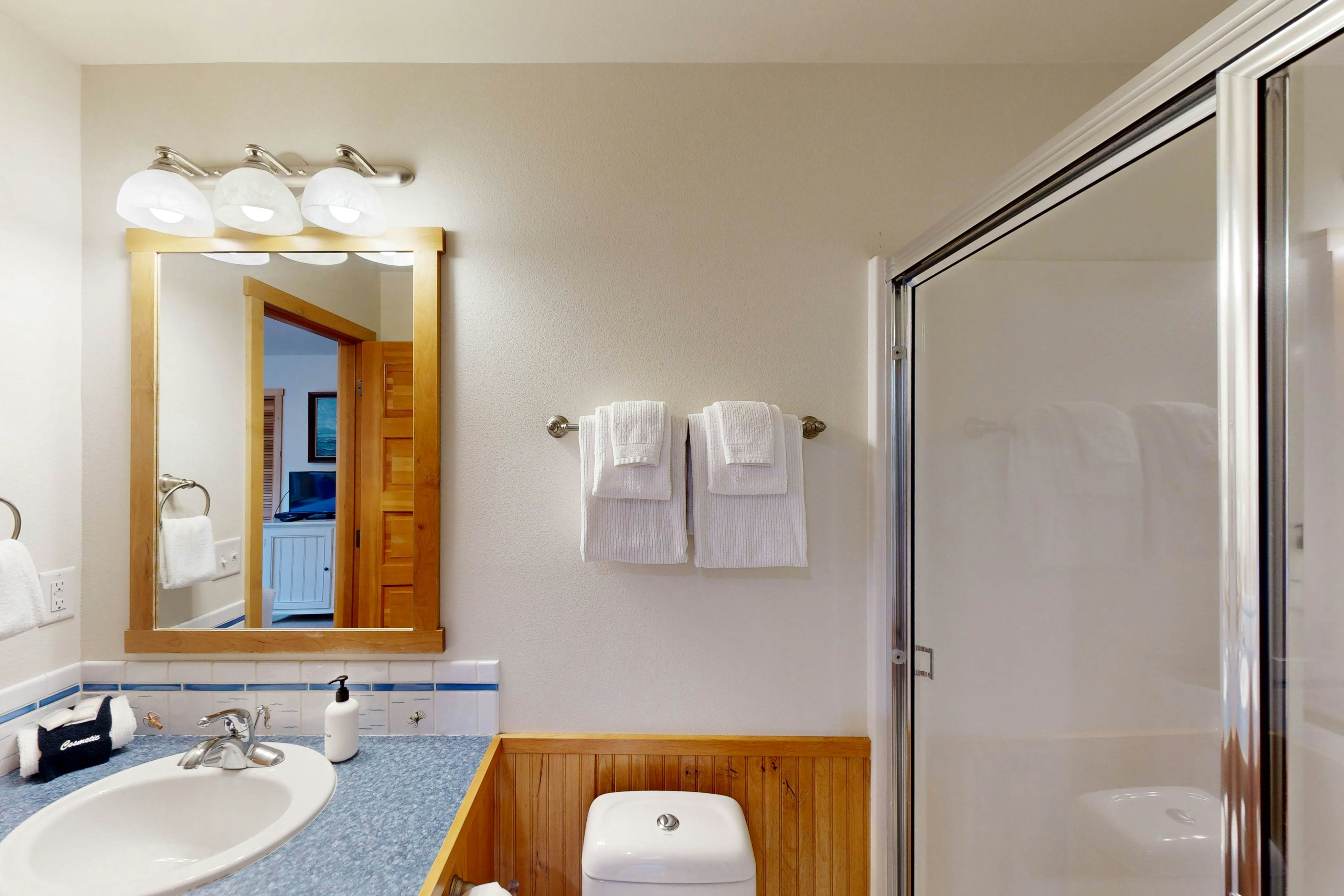 Coastal home walking distance to the beach with outdoor shower & fireplace