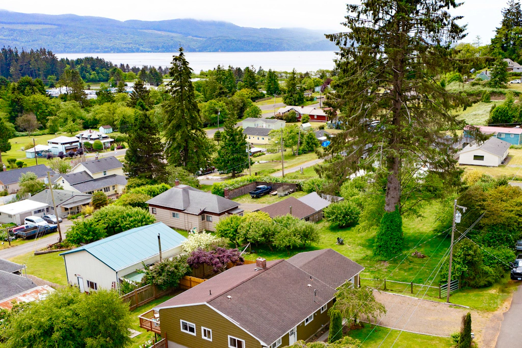 Water view retreat with scenic deck grill yard fireplace board games and with D