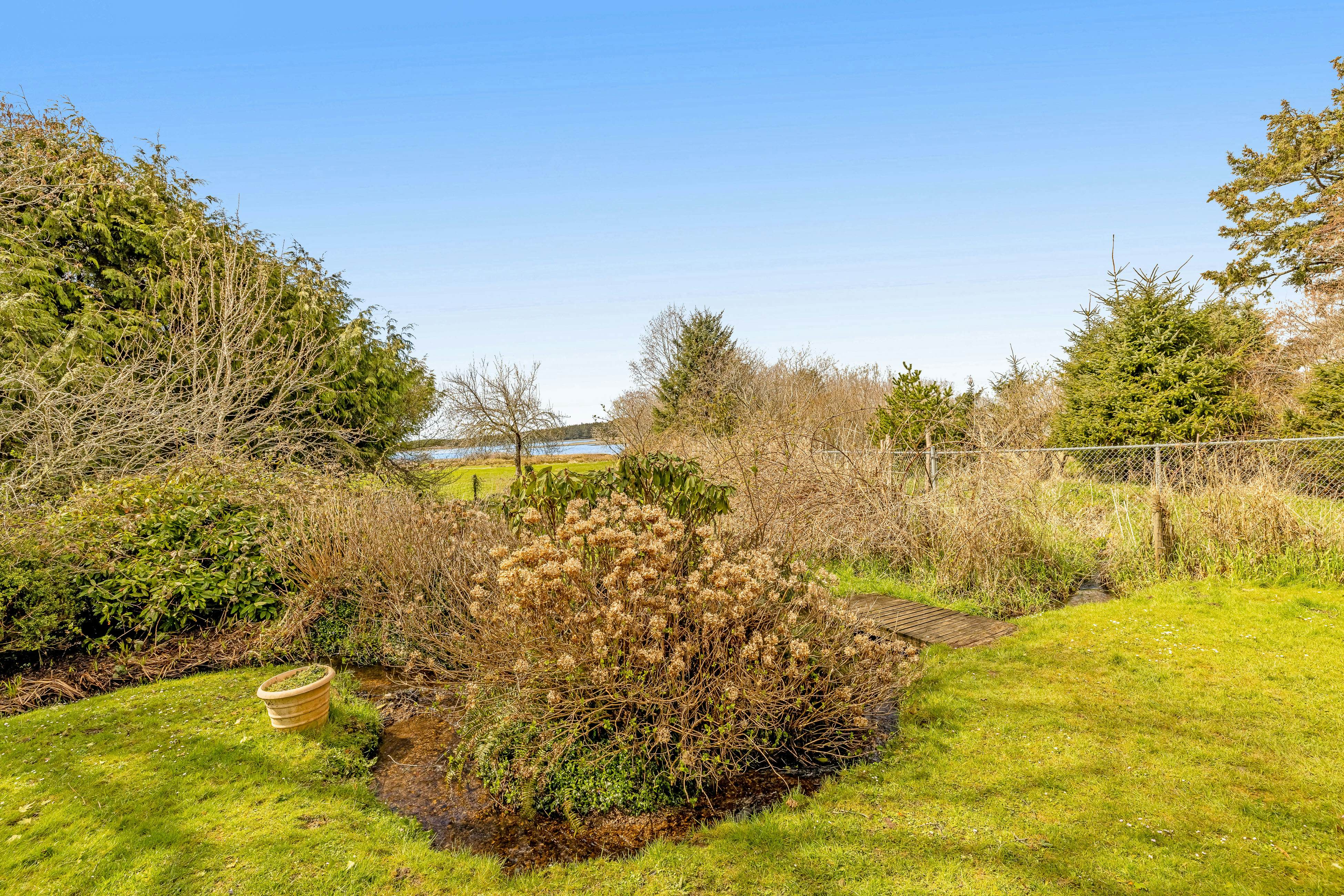 Serene Sandlake Bayfront Home with WiFi & Private Hot Tub - Dogs Welcome