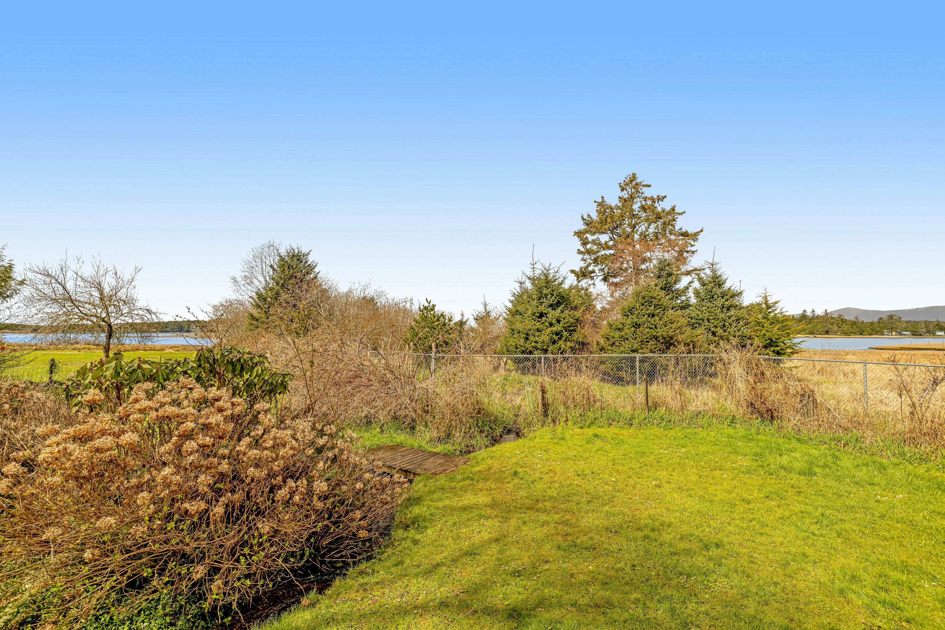 Serene Sandlake Bayfront Home with WiFi & Private Hot Tub - Dogs Welcome