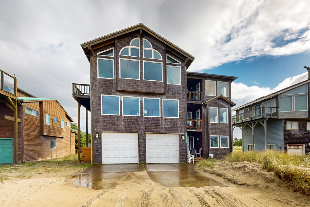 Gorgeous waterfront home with ocean views a furnished deck and beach access