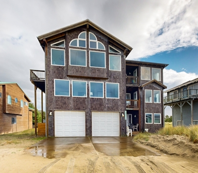 Gorgeous waterfront home with ocean views a furnished deck and beach access