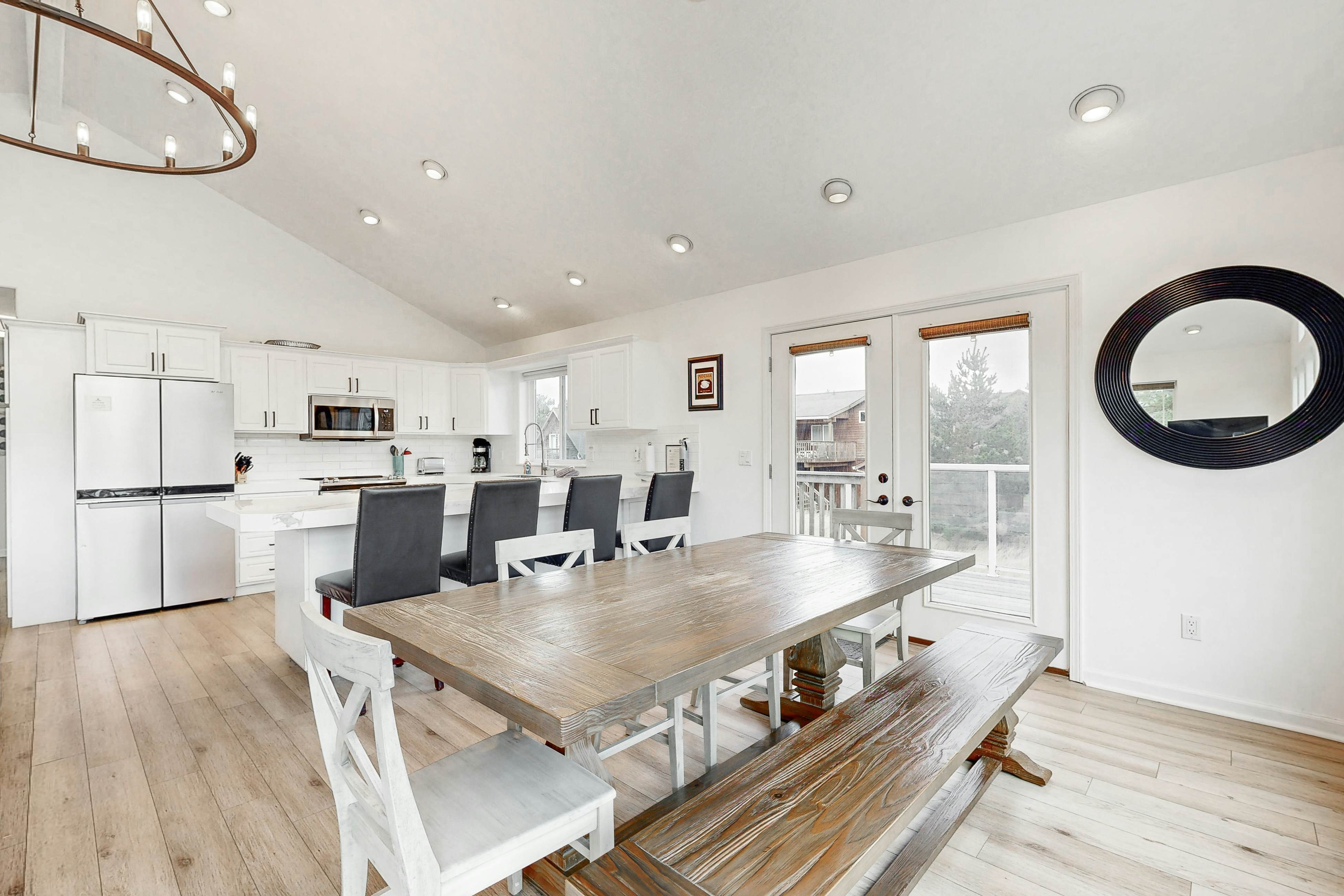Bright, remodeled home with furnished deck & private beach access - dog-friendly