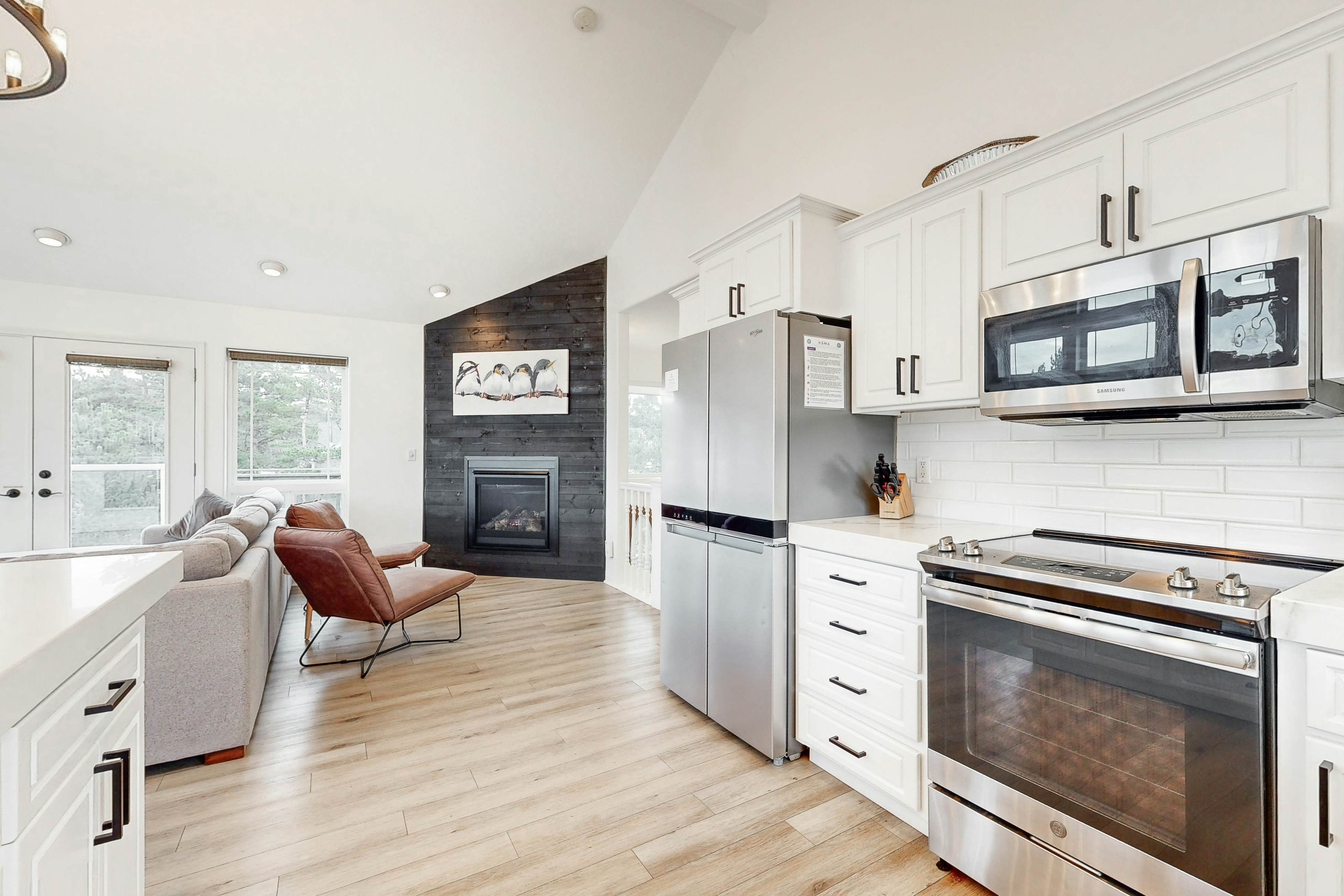 Bright, remodeled home with furnished deck & private beach access - dog-friendly