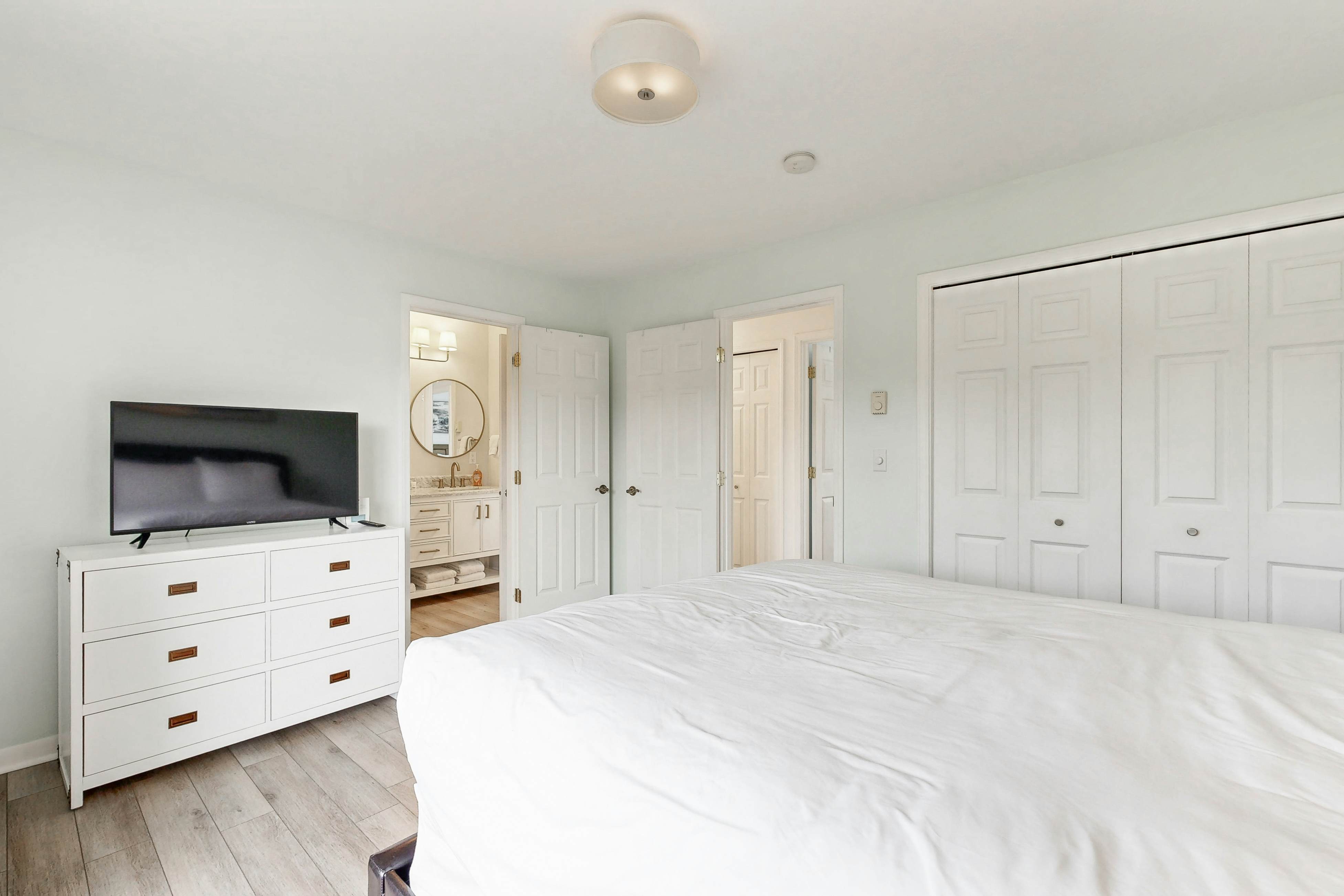 Bright, remodeled home with furnished deck & private beach access - dog-friendly