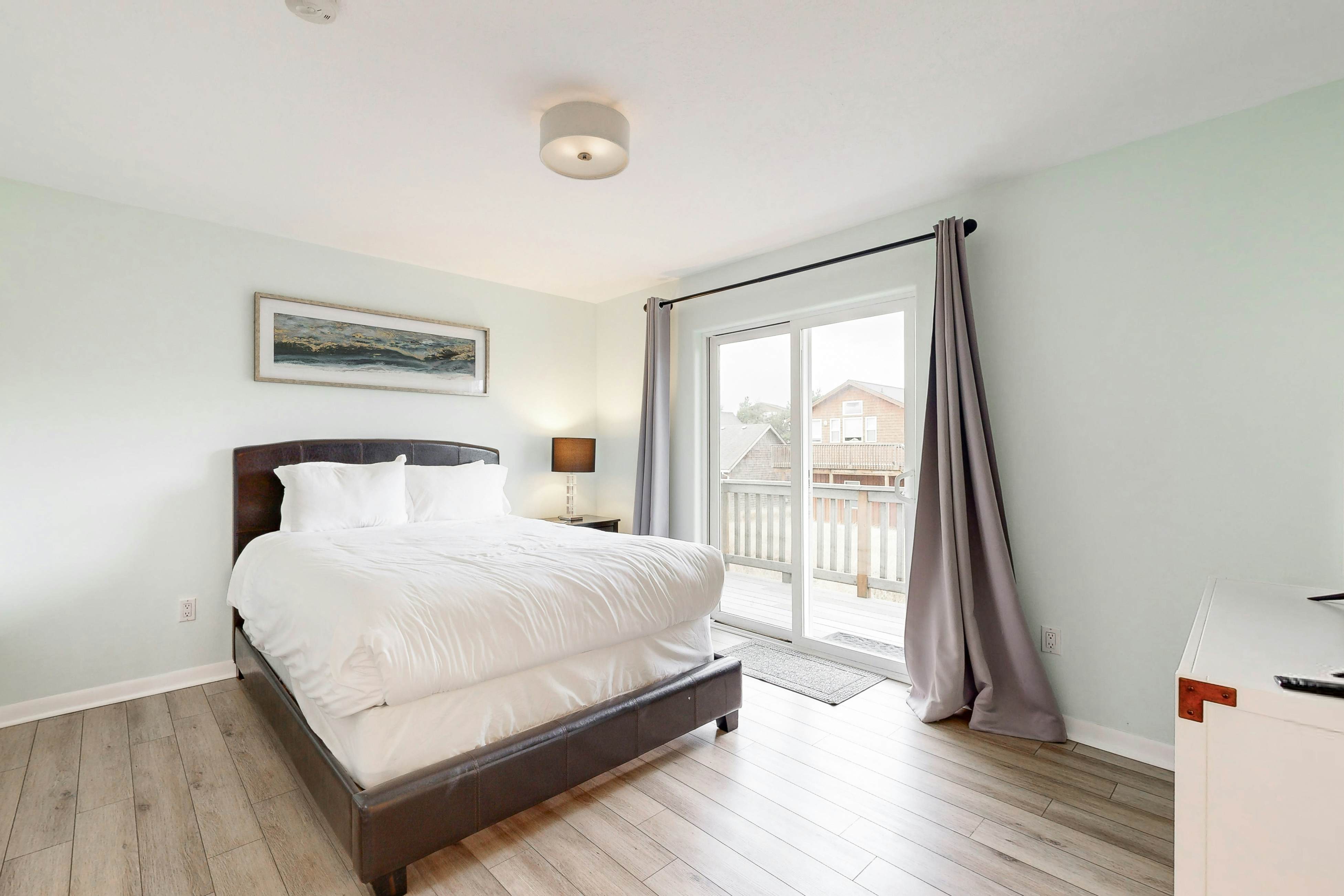 Bright, remodeled home with furnished deck & private beach access - dog-friendly