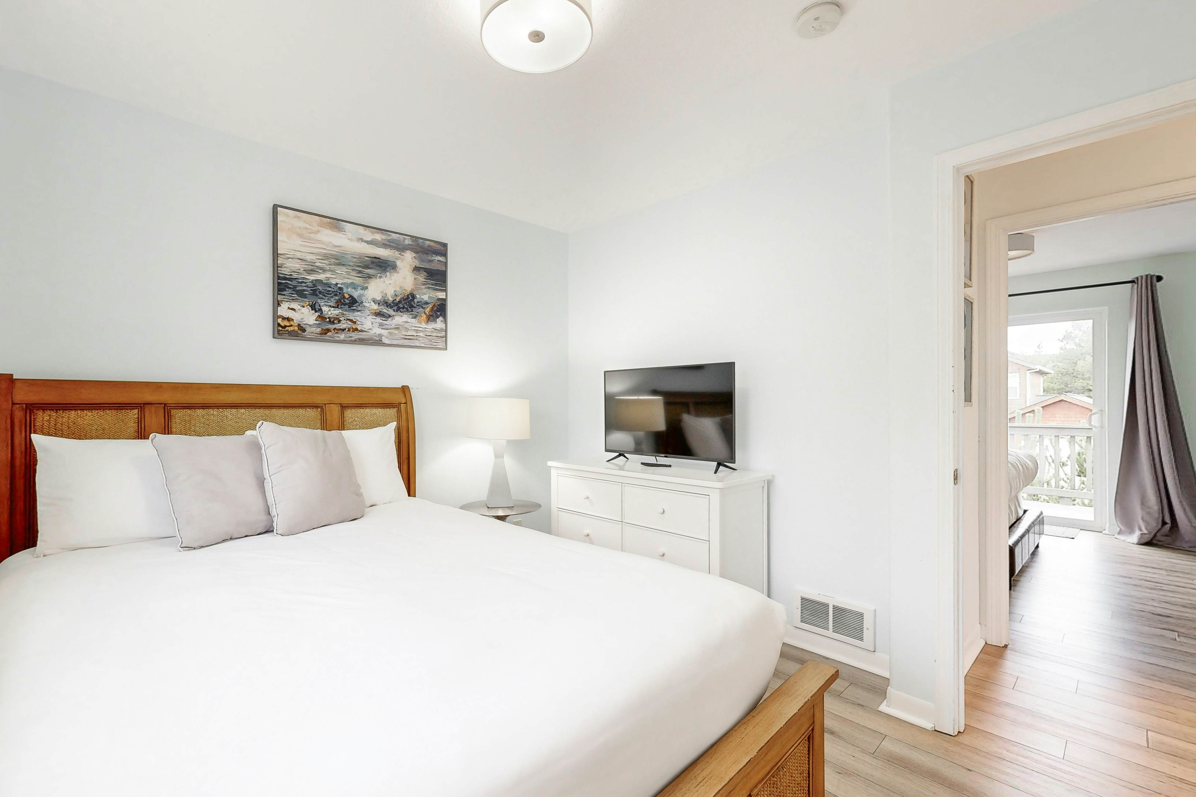 Bright, remodeled home with furnished deck & private beach access - dog-friendly