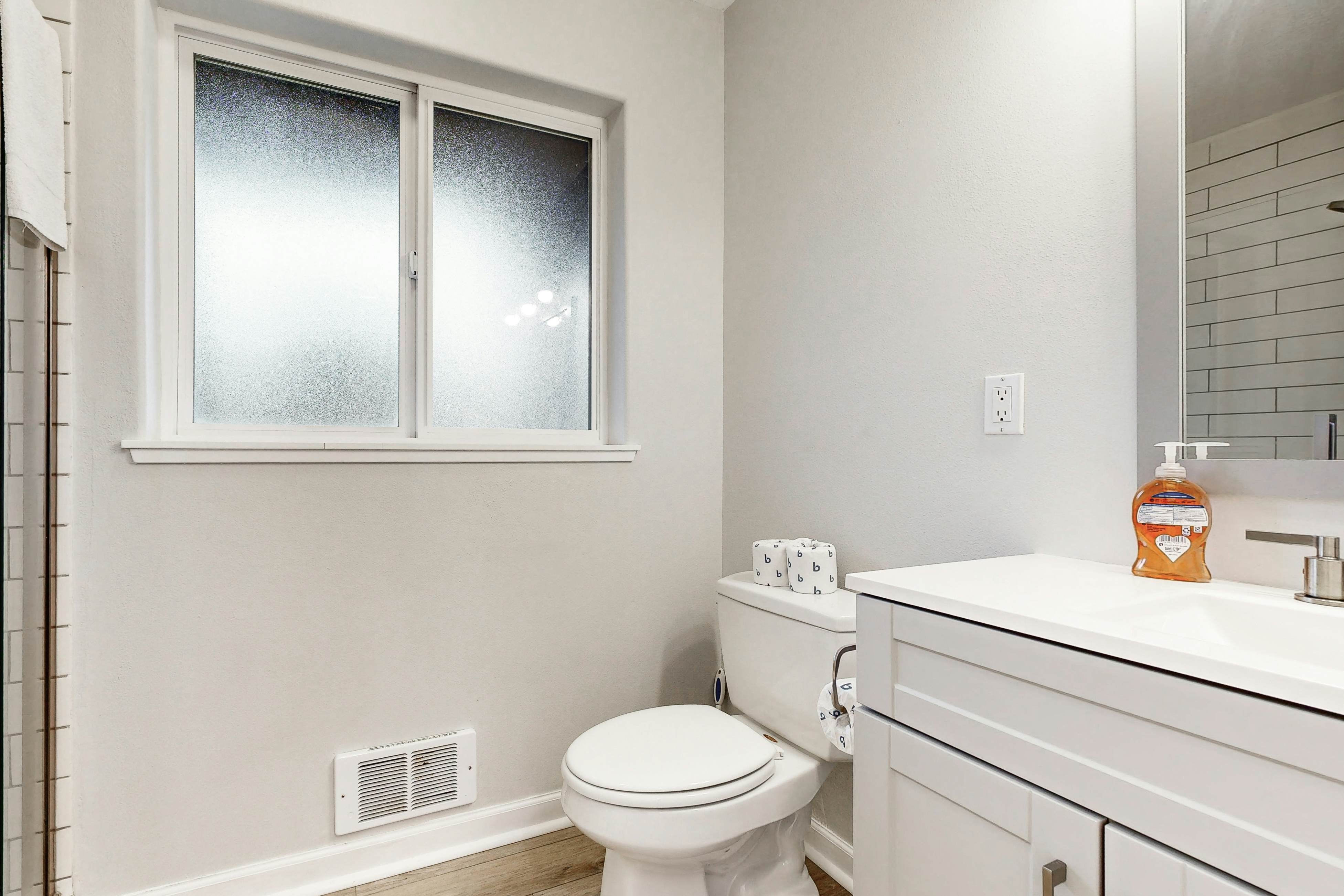 Bright, remodeled home with furnished deck & private beach access - dog-friendly