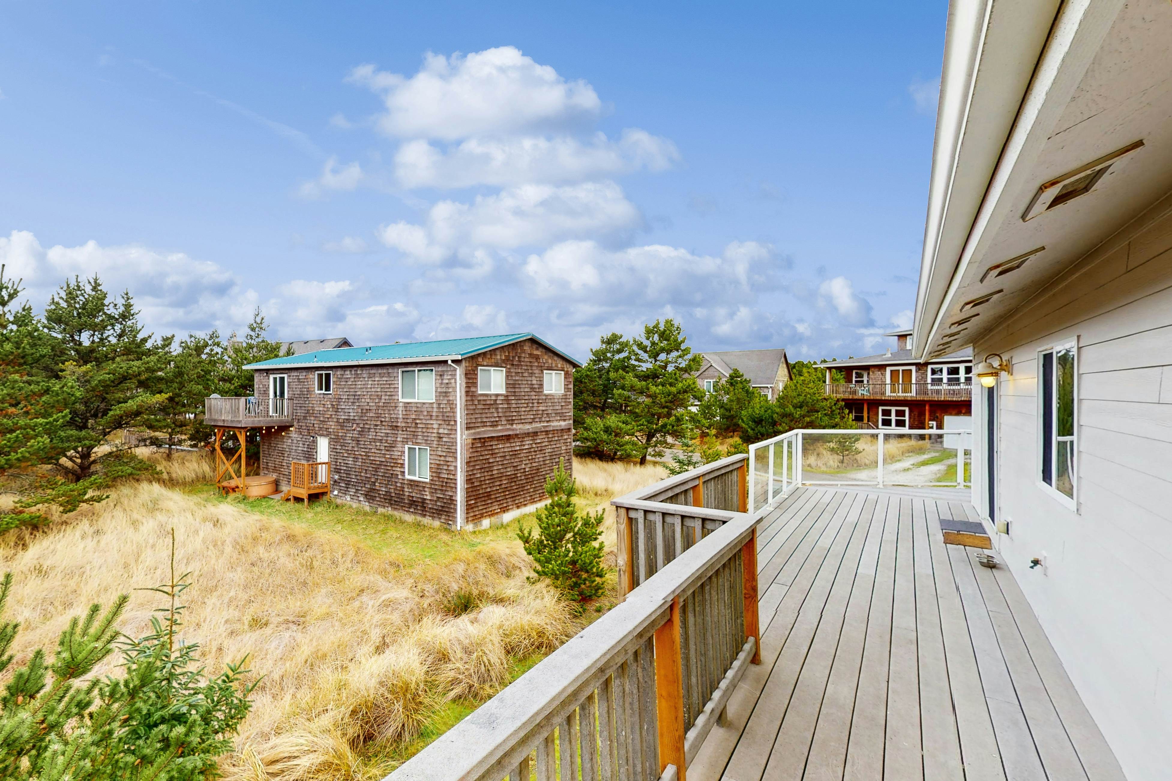 Bright, remodeled home with furnished deck & private beach access - dog-friendly
