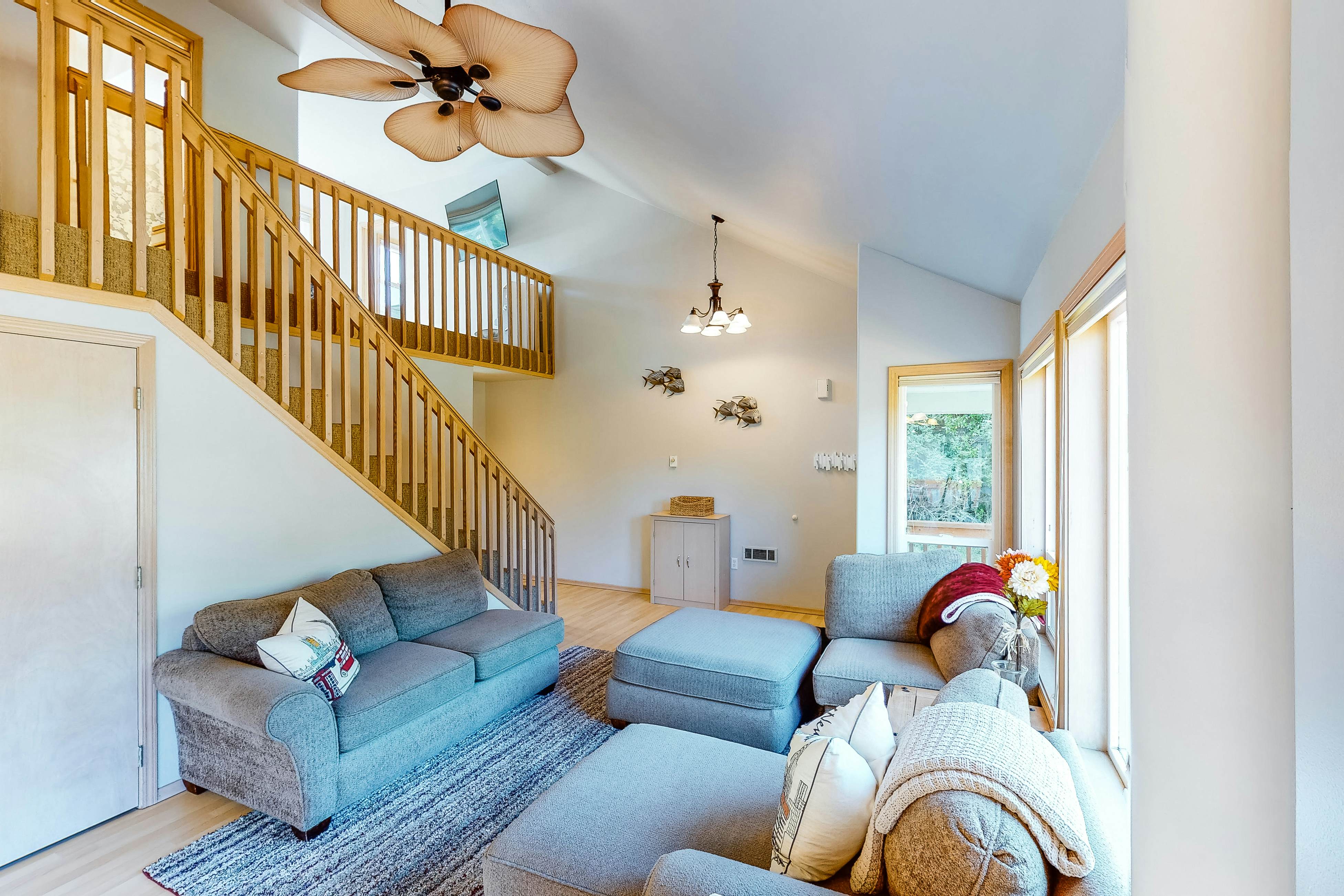 Bright dog-friendly home with wrap-around deck just steps from beach
