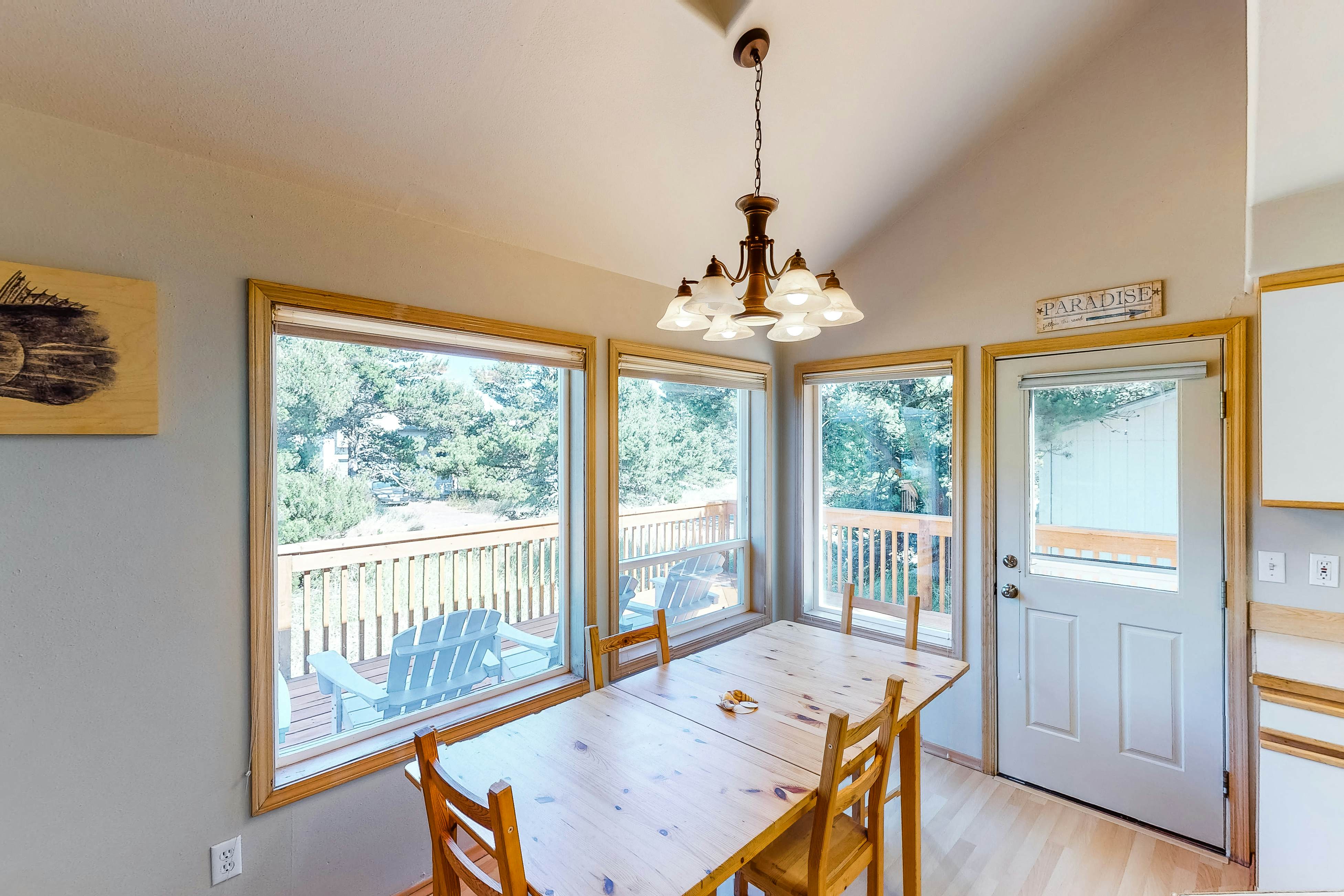 Bright dog-friendly home with wrap-around deck just steps from beach