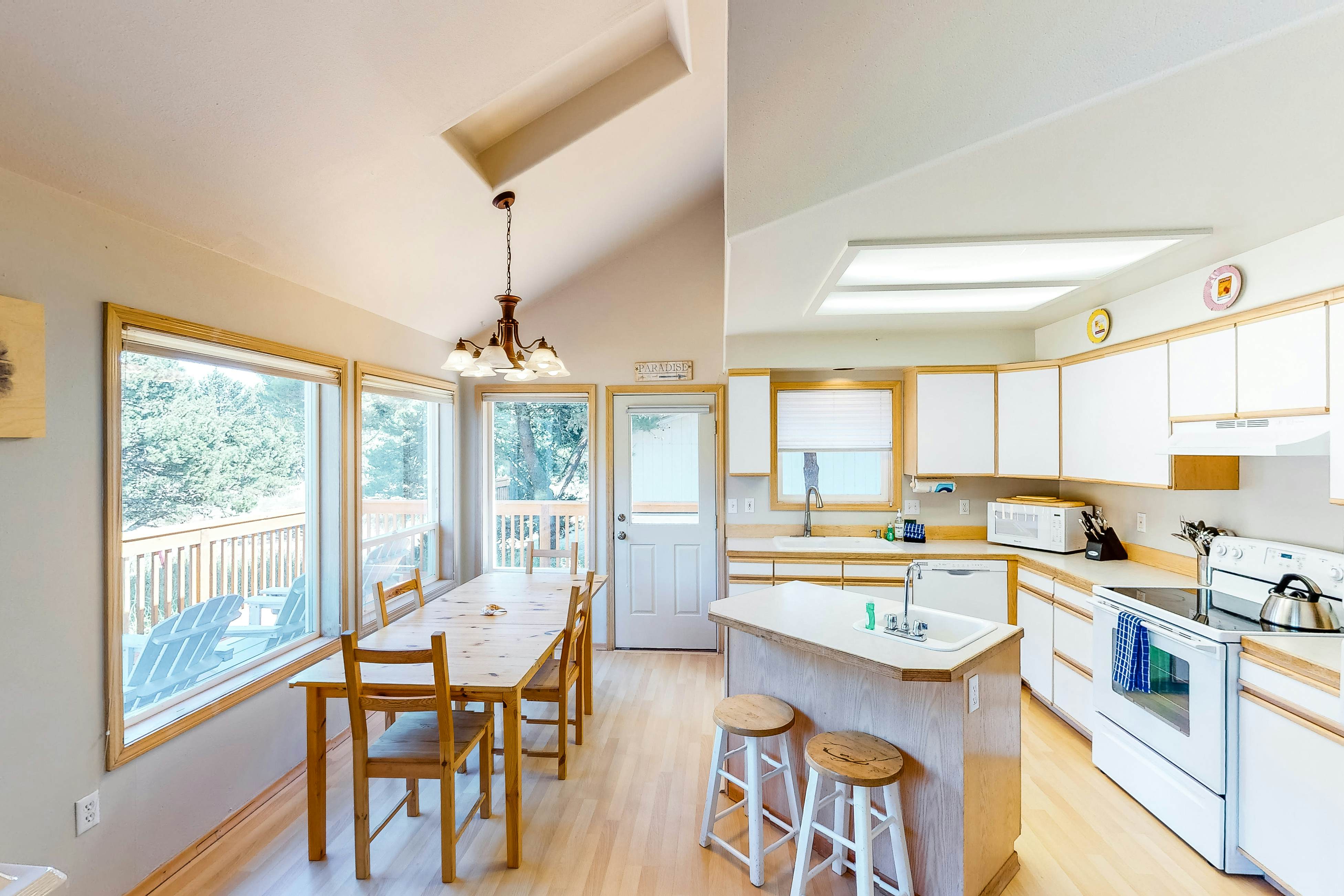 Bright dog-friendly home with wrap-around deck just steps from beach