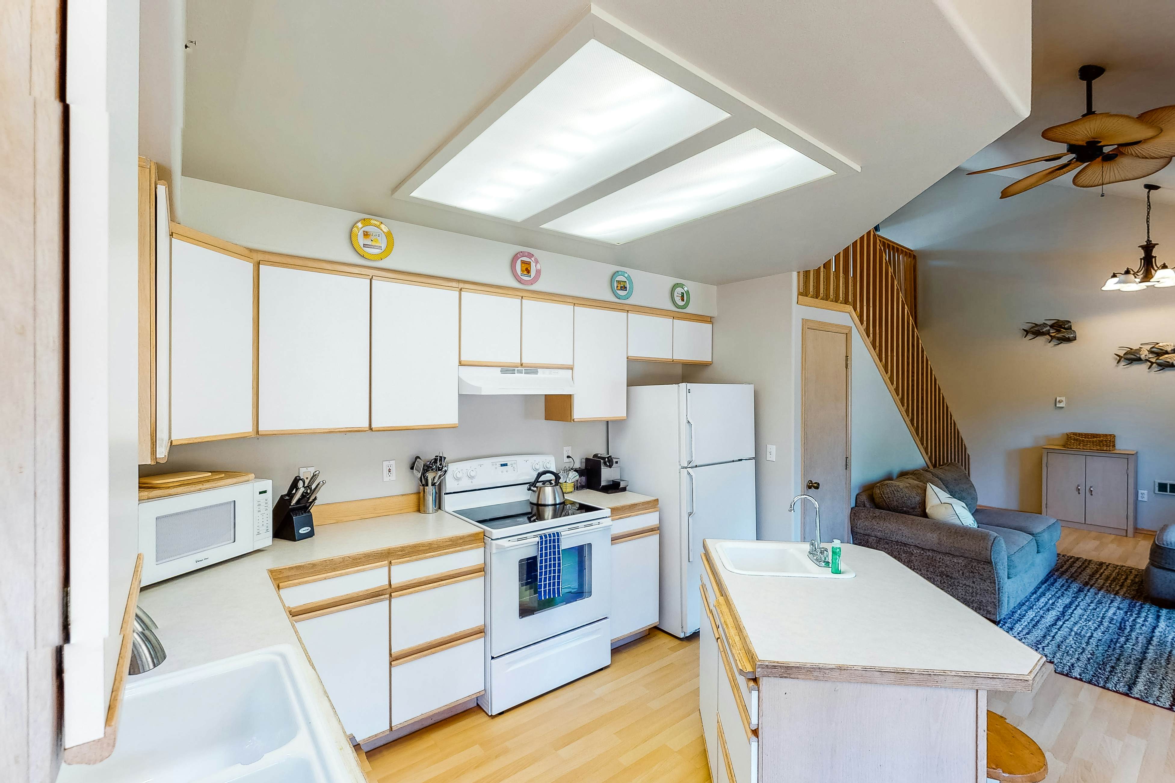 Bright dog-friendly home with wrap-around deck just steps from beach