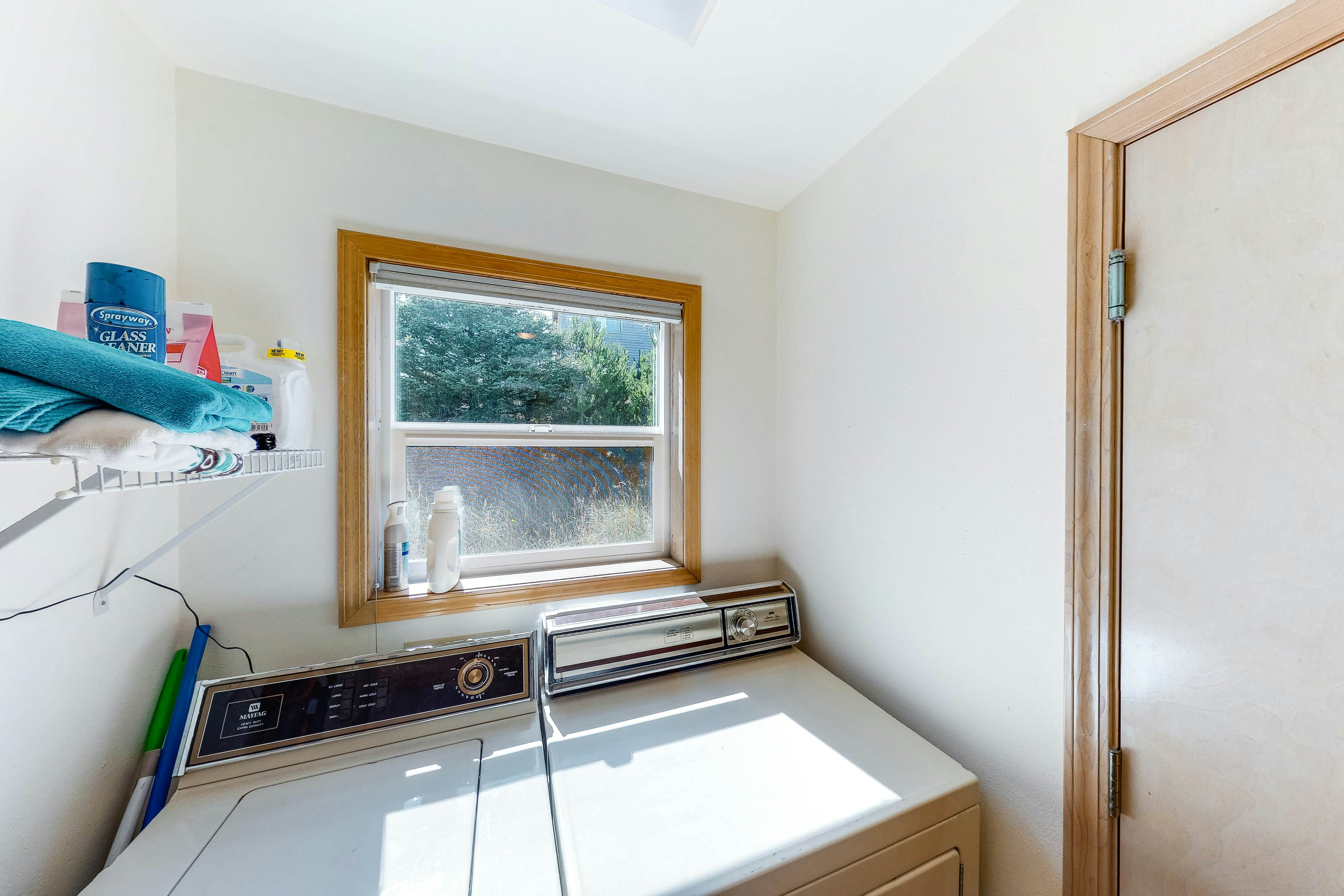 Bright dog-friendly home with wrap-around deck just steps from beach