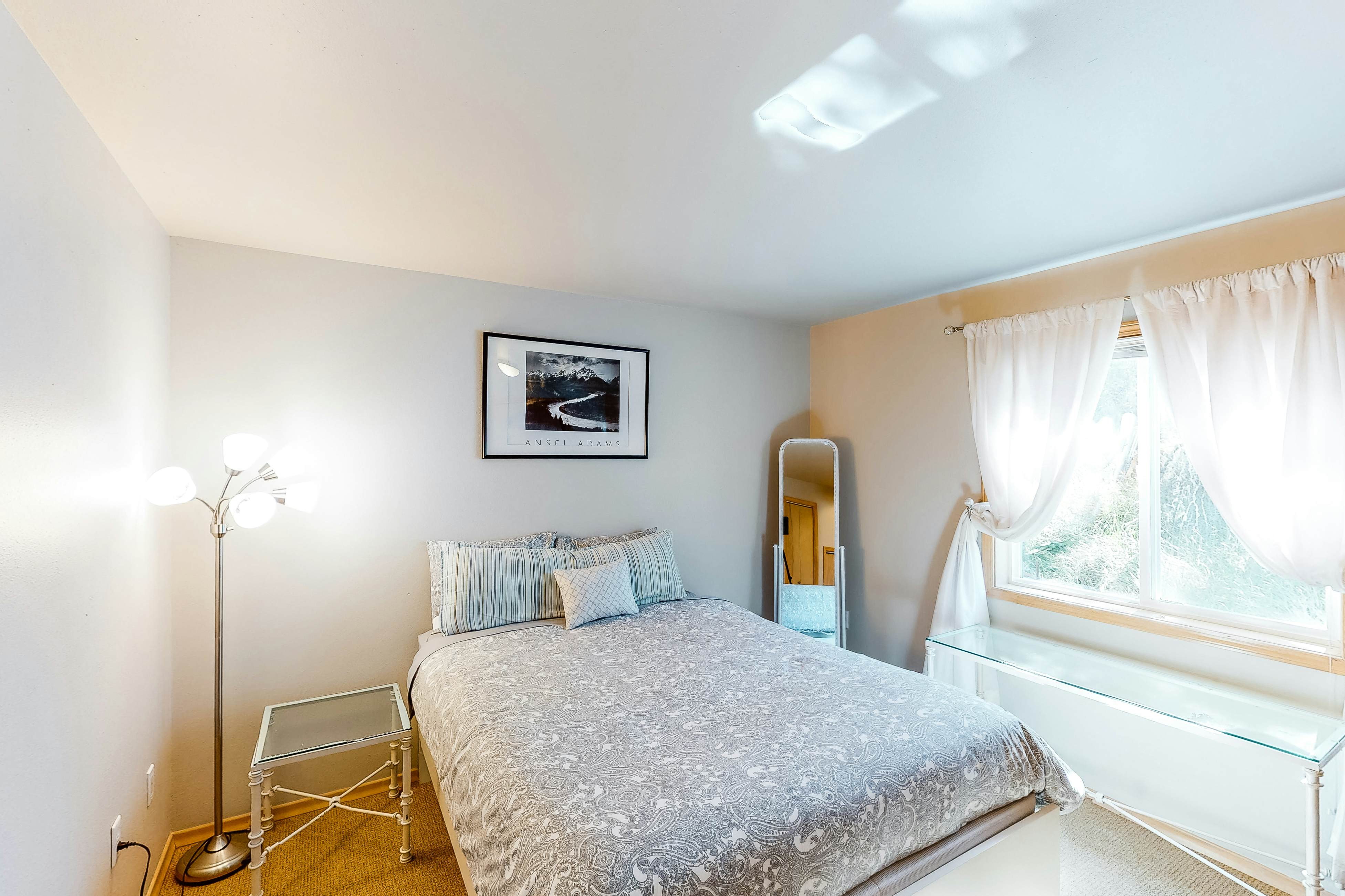 Bright dog-friendly home with wrap-around deck just steps from beach