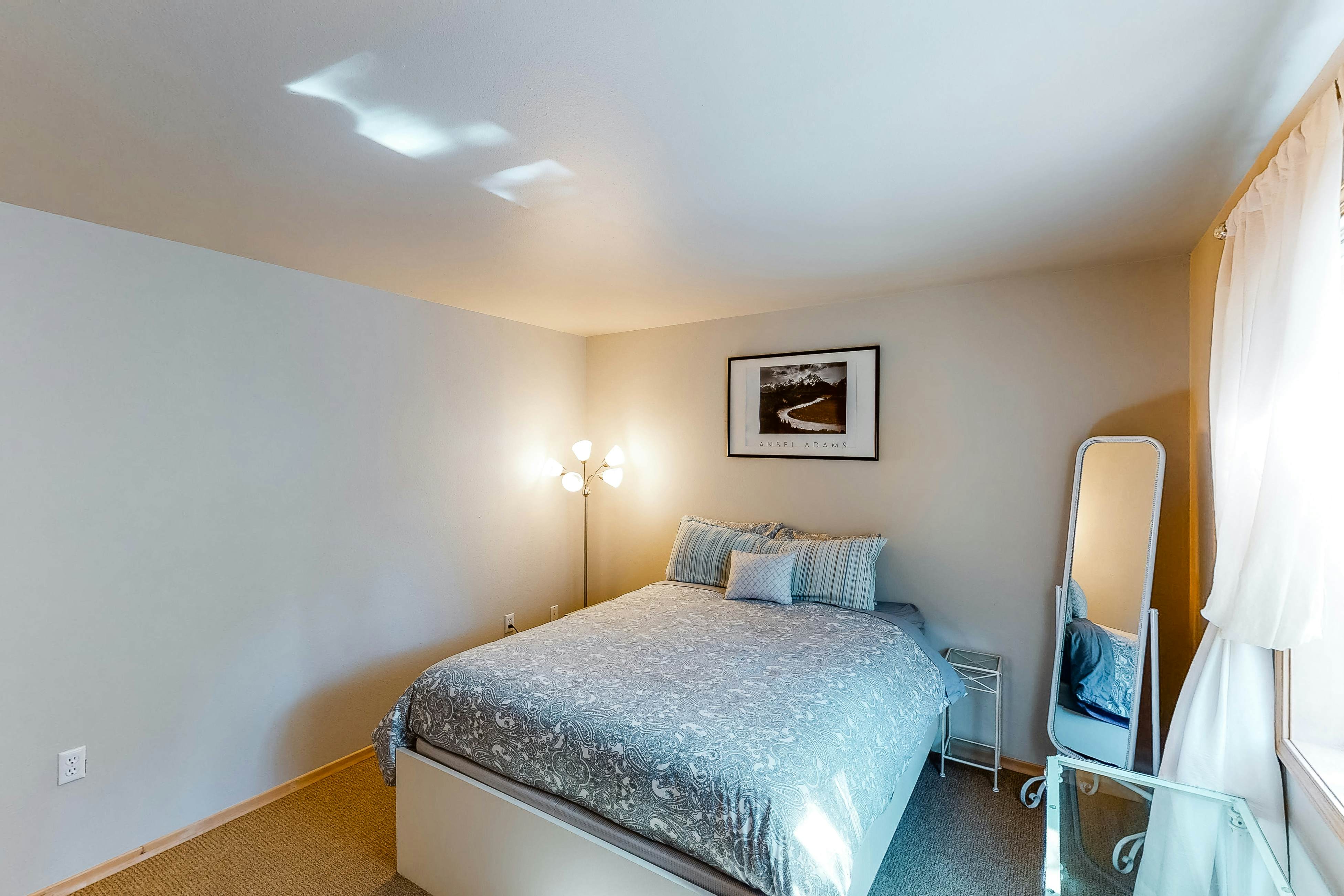 Bright dog-friendly home with wrap-around deck just steps from beach