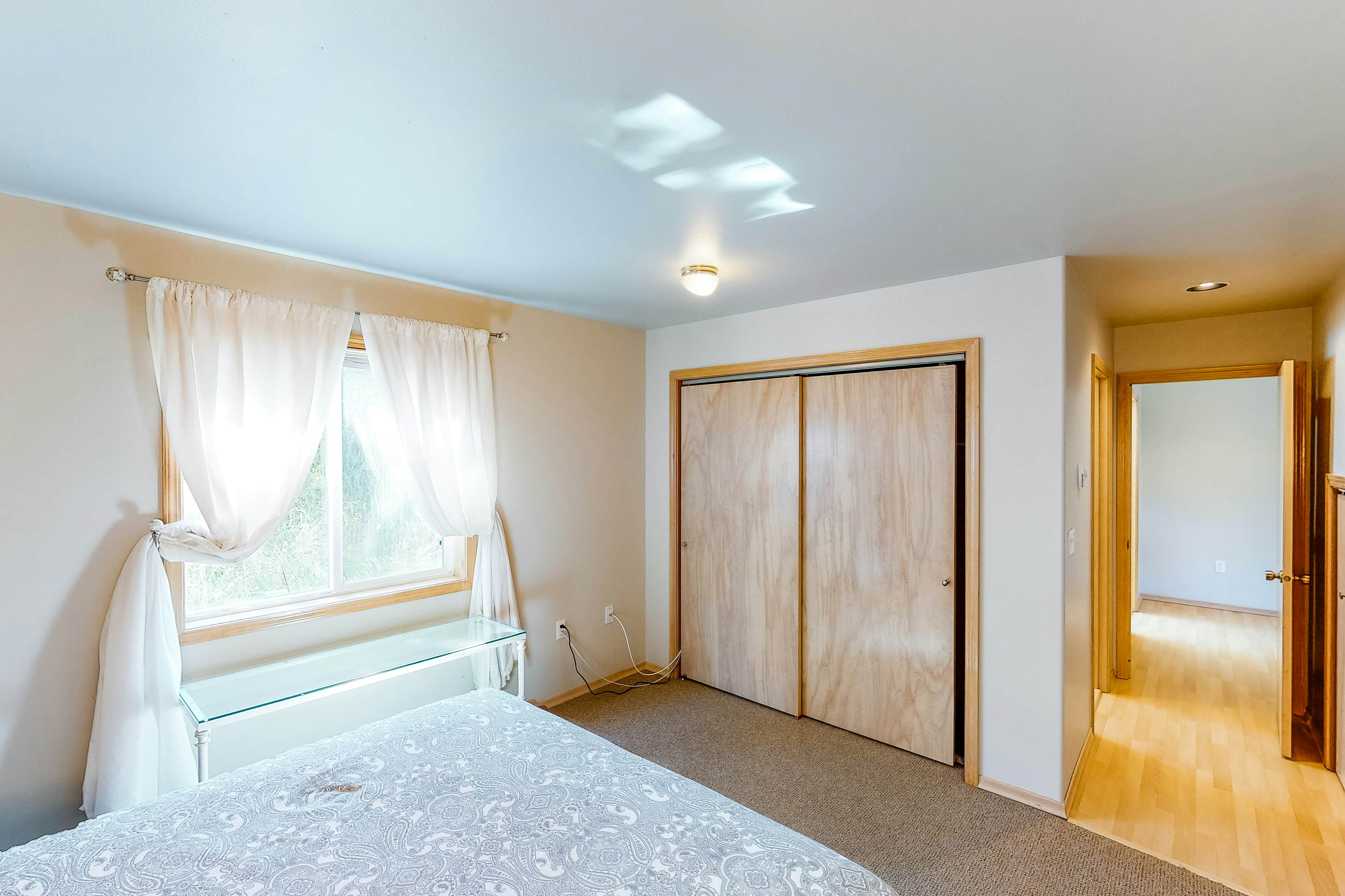 Bright dog-friendly home with wrap-around deck just steps from beach