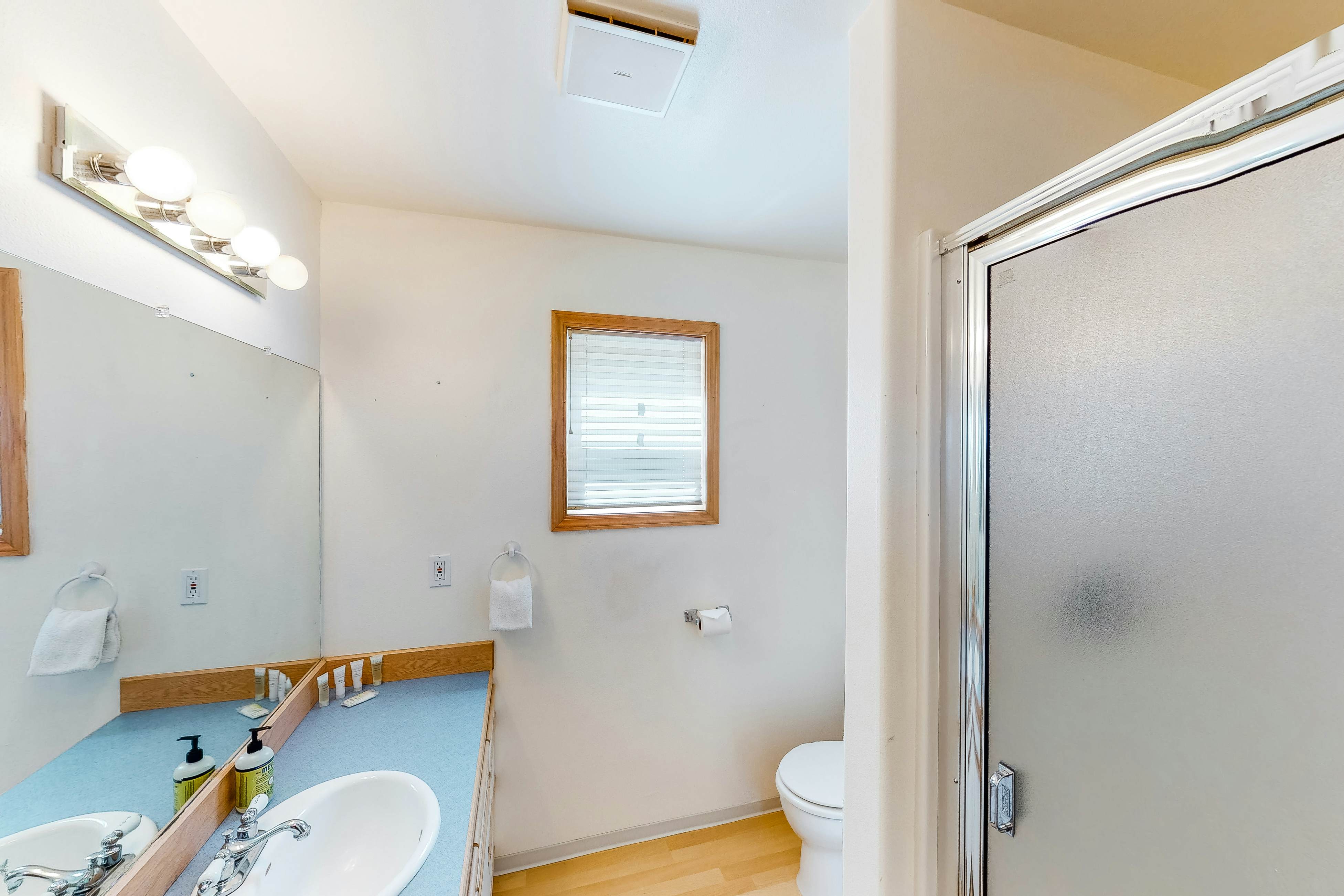 Bright dog-friendly home with wrap-around deck just steps from beach