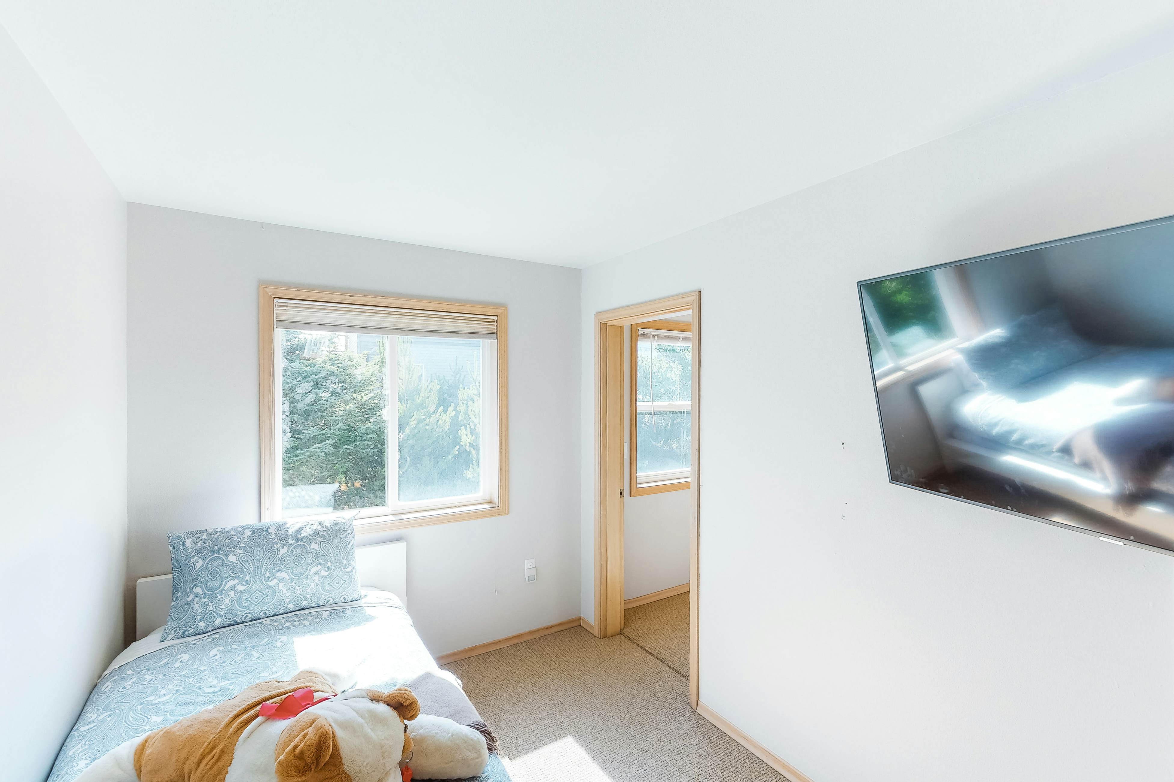 Bright dog-friendly home with wrap-around deck just steps from beach