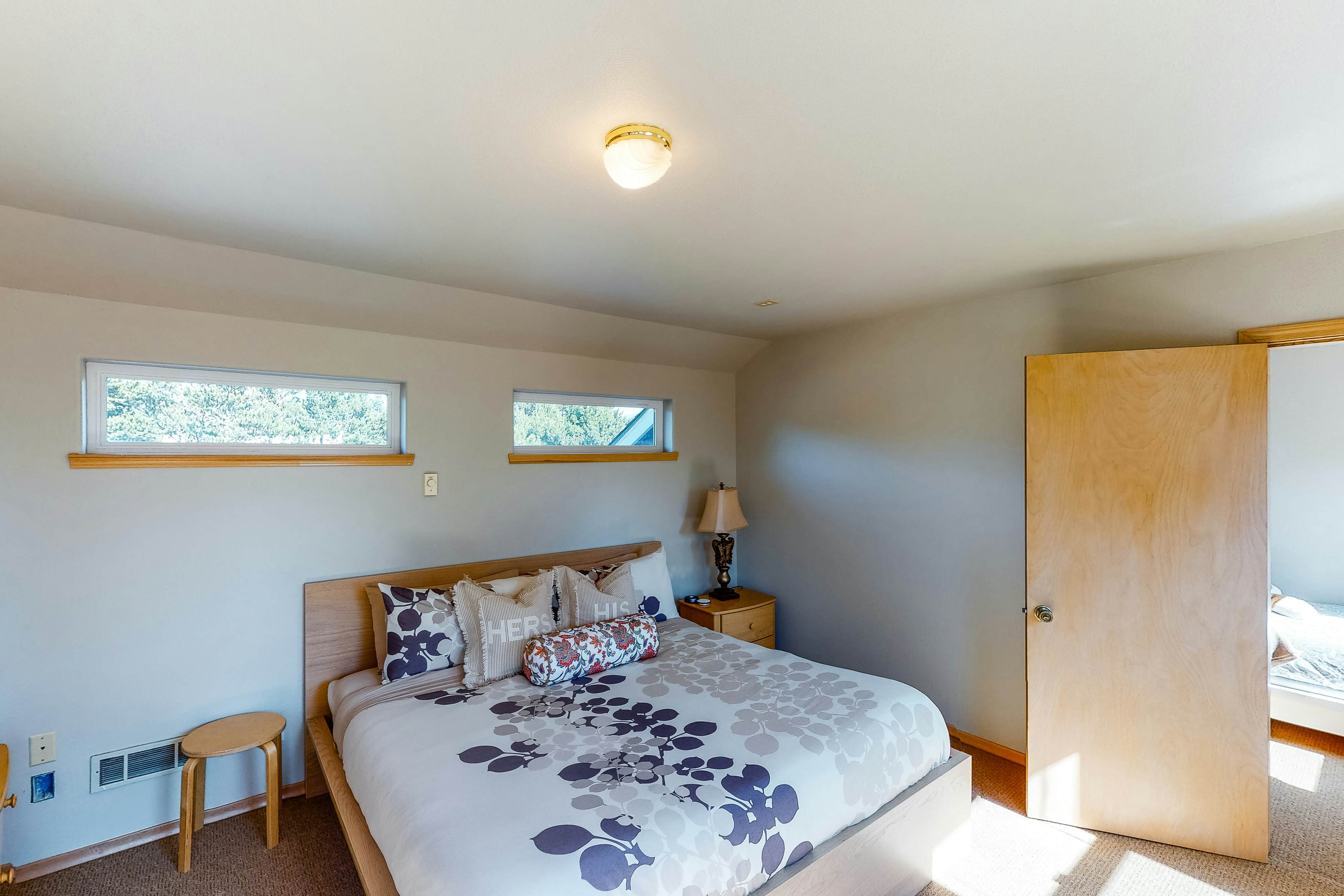 Bright dog-friendly home with wrap-around deck just steps from beach