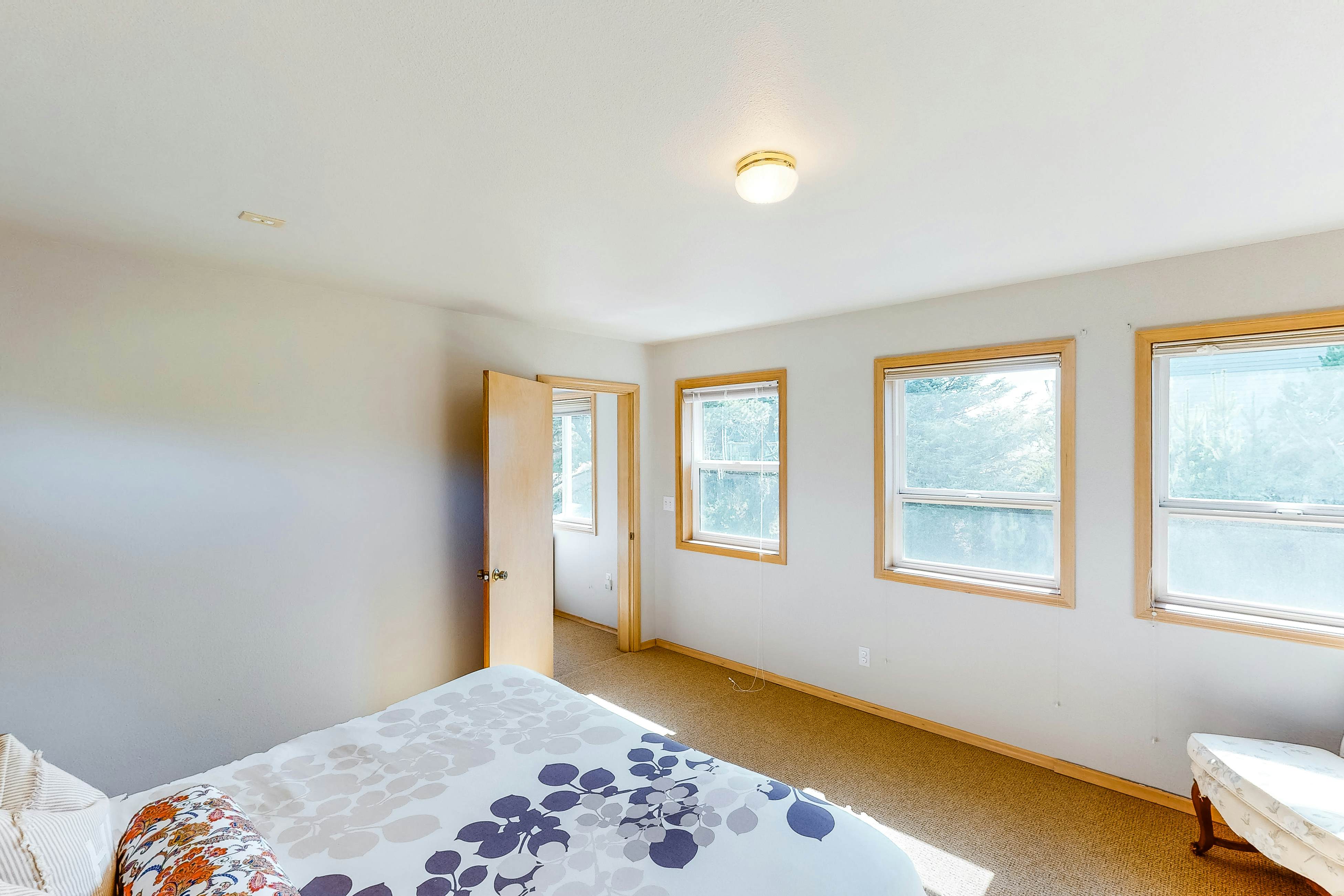 Bright dog-friendly home with wrap-around deck just steps from beach