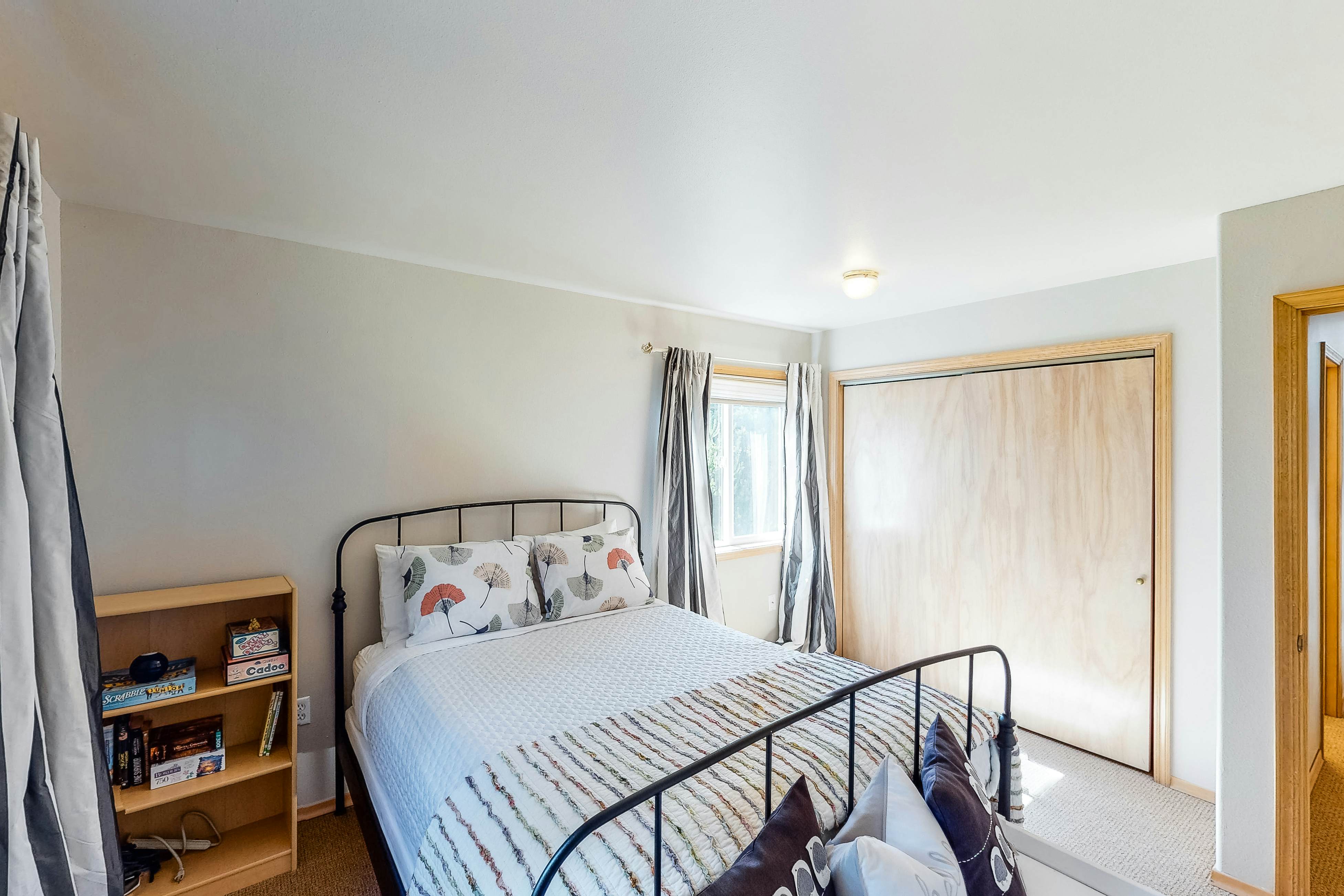 Bright dog-friendly home with wrap-around deck just steps from beach