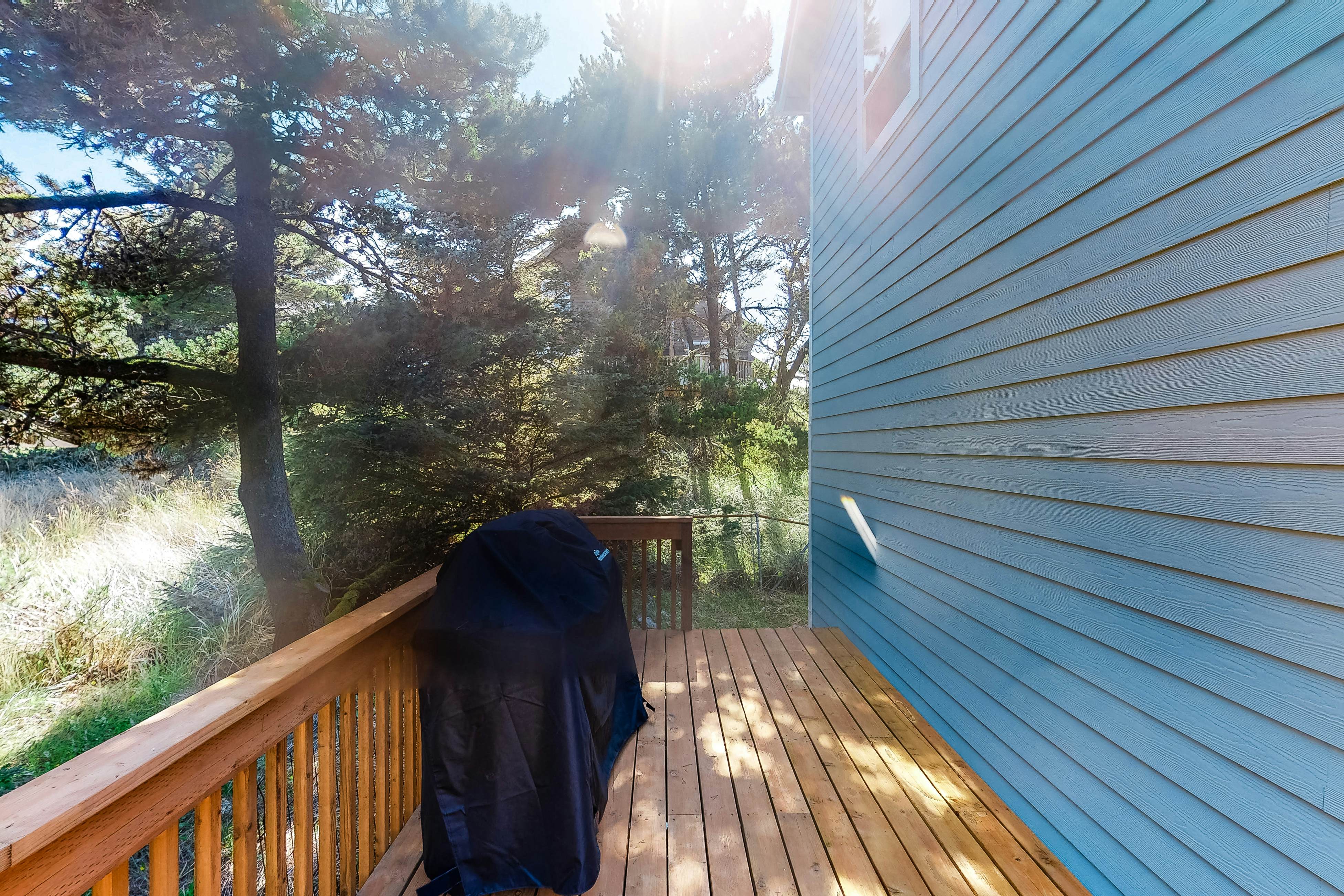 Bright dog-friendly home with wrap-around deck just steps from beach