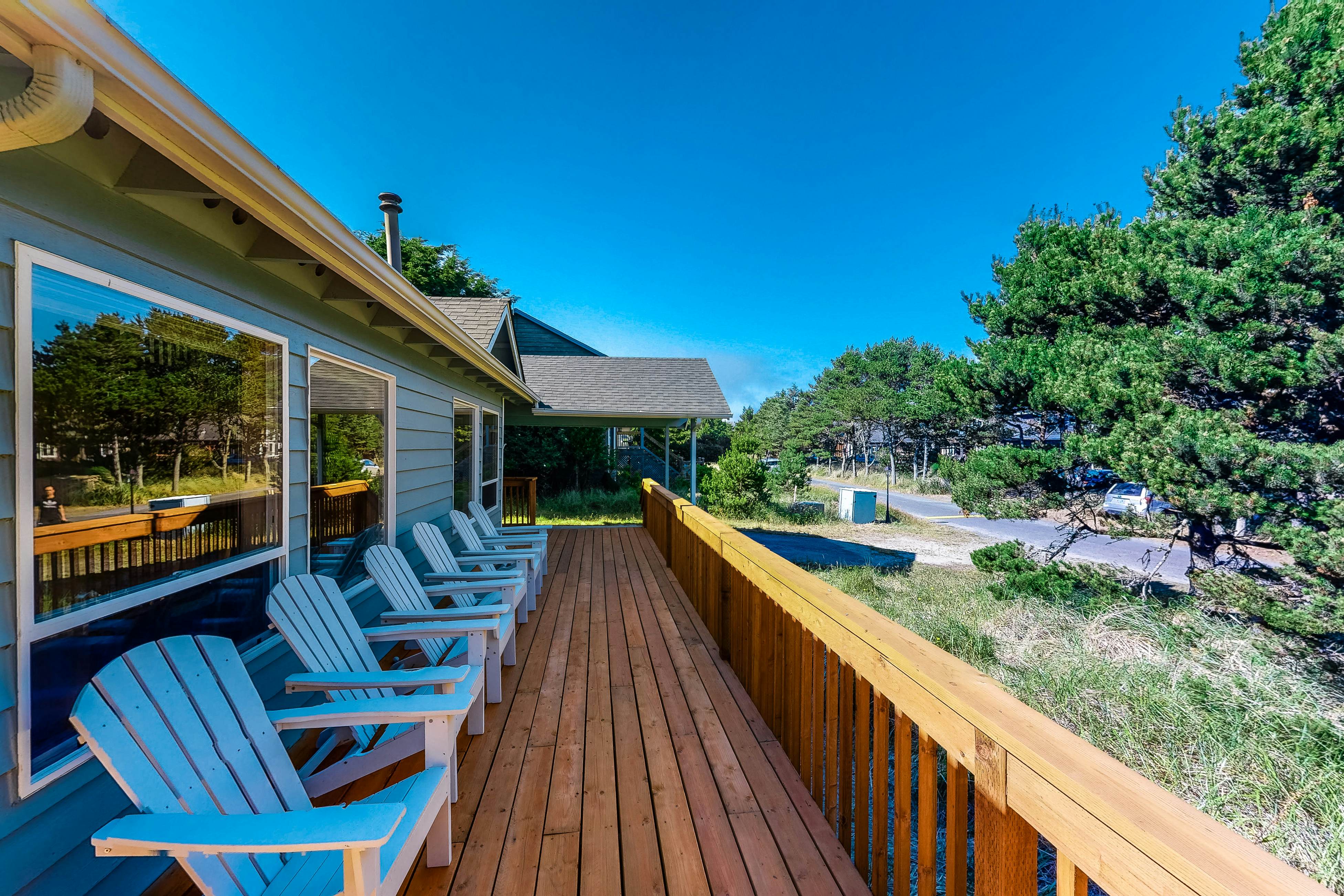 Bright dog-friendly home with wrap-around deck just steps from beach