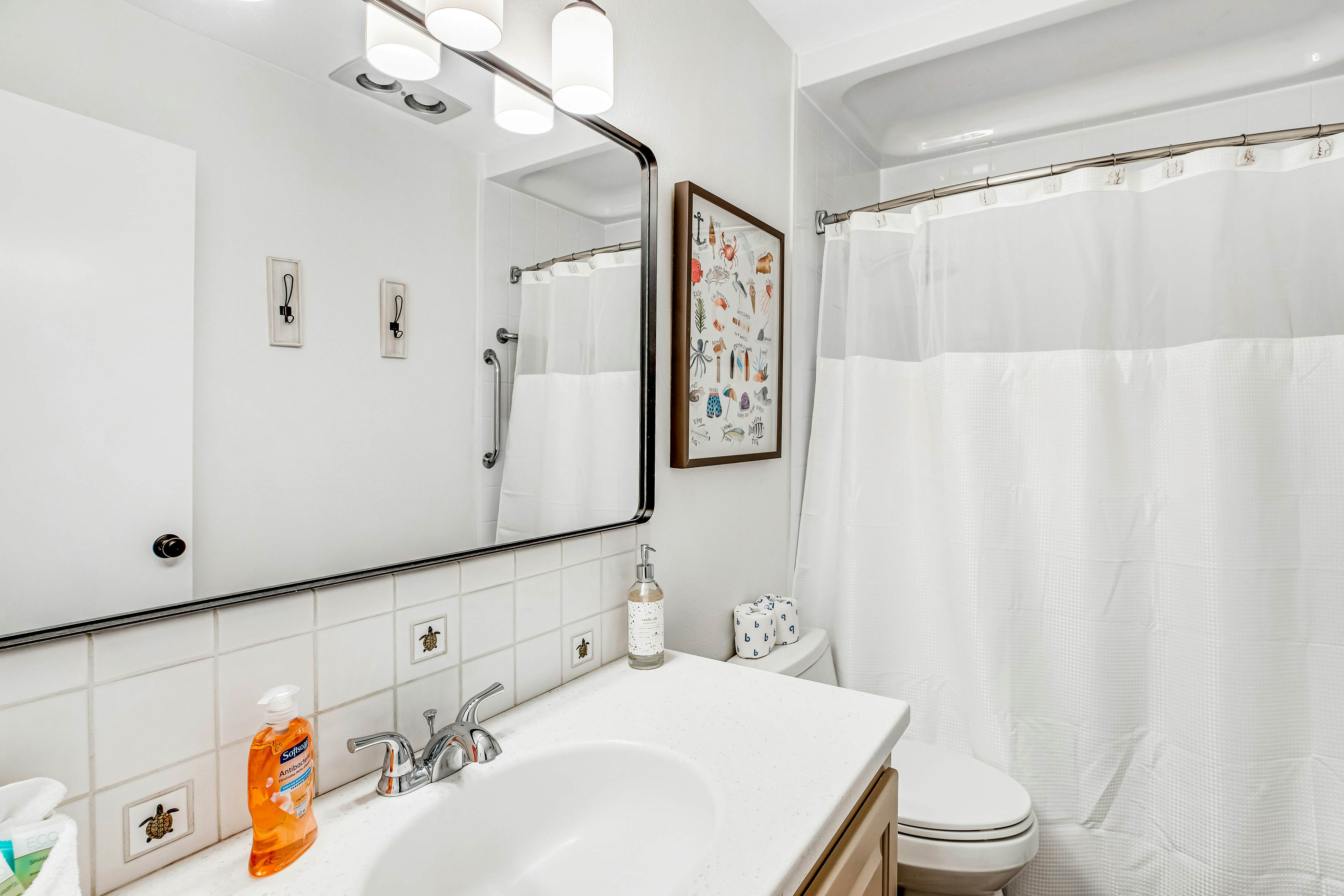 Vibrant, polished condo with oceanfront views, patio & W/D access