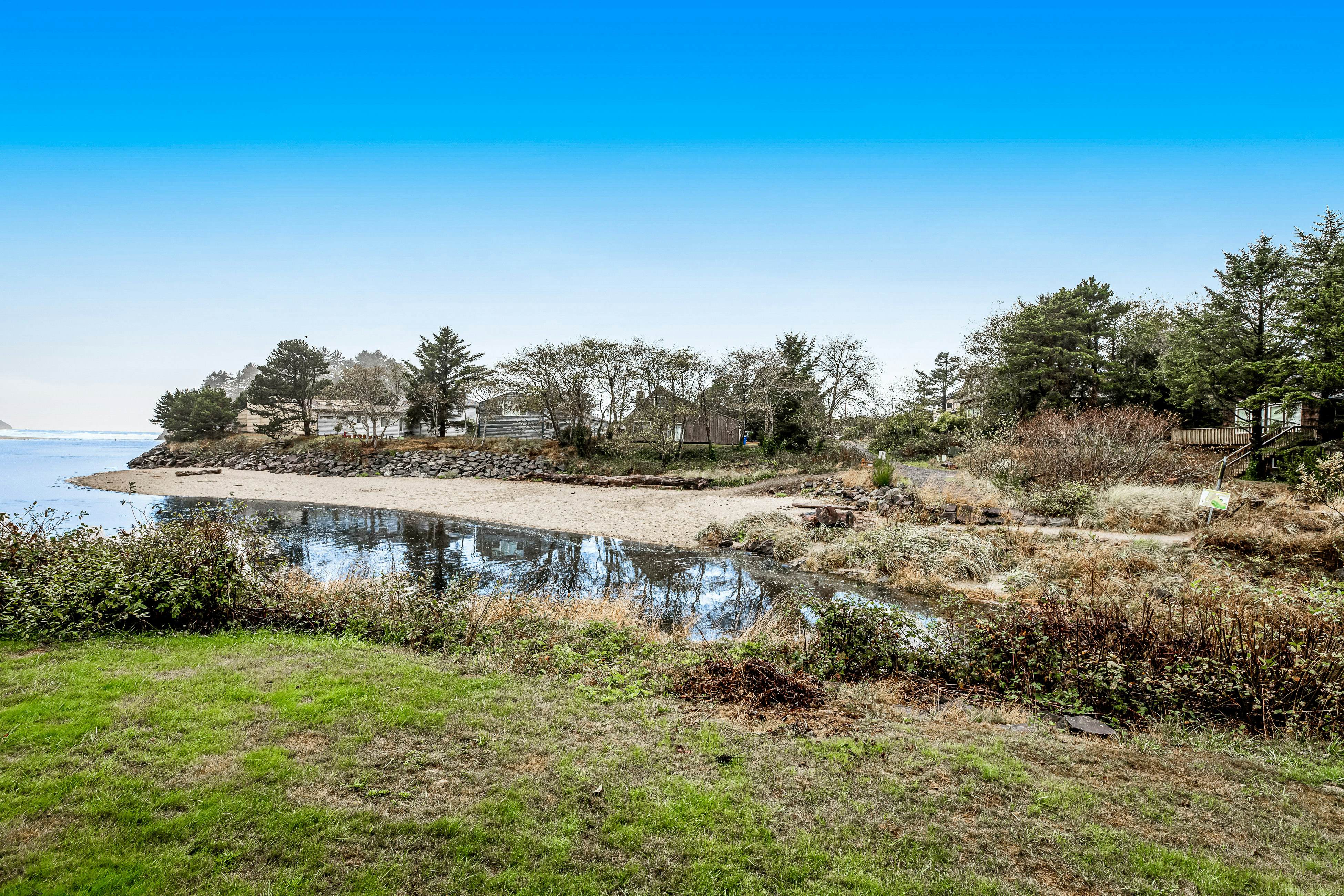 Vibrant, polished condo with oceanfront views, patio & W/D access