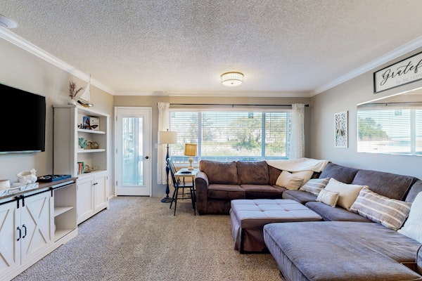 Creekfront Condo with Private Patio Beach Access Shared with D Gas Grill and Views