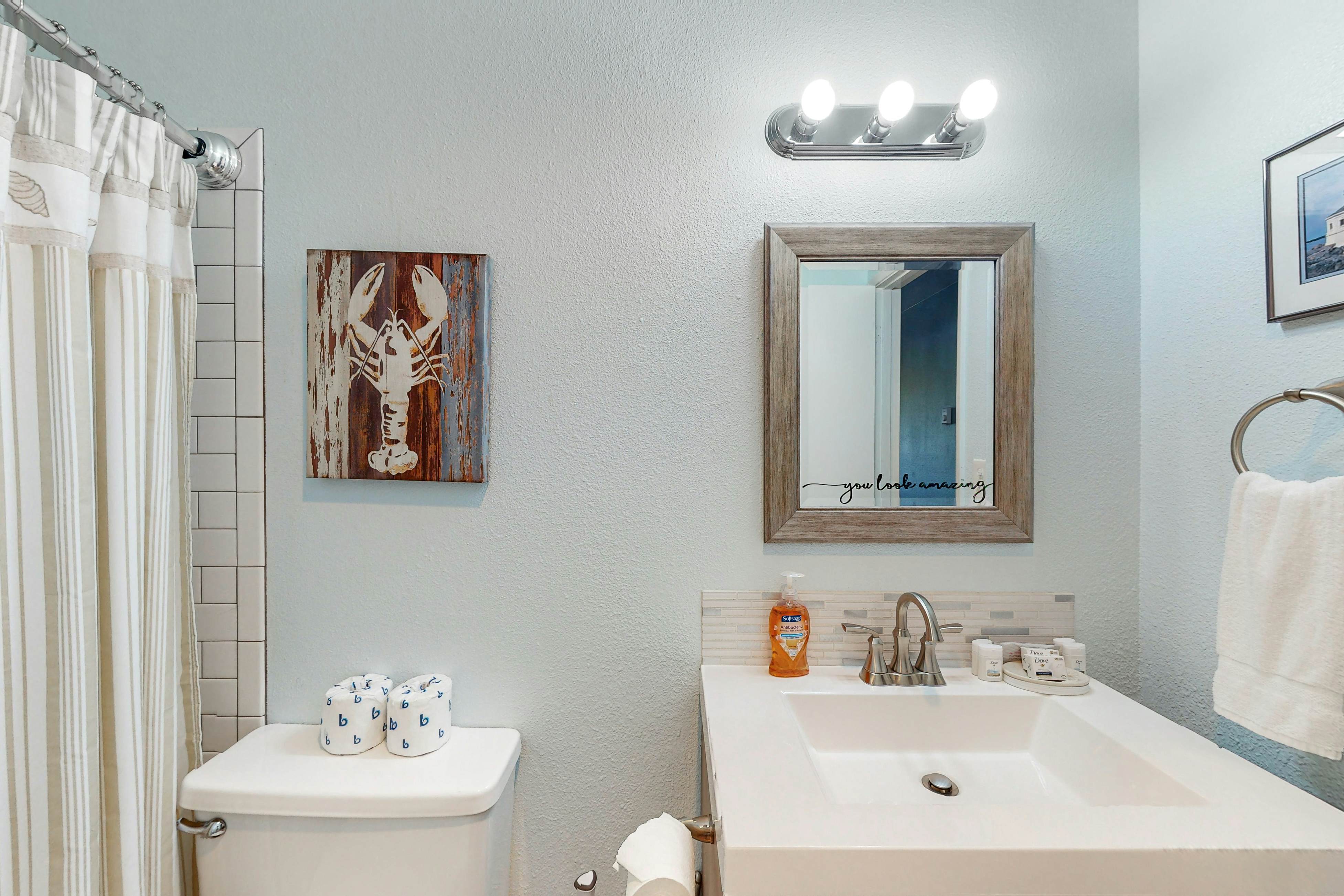 Third-floor beachfront condo with a balcony, full kitchen, & ocean views