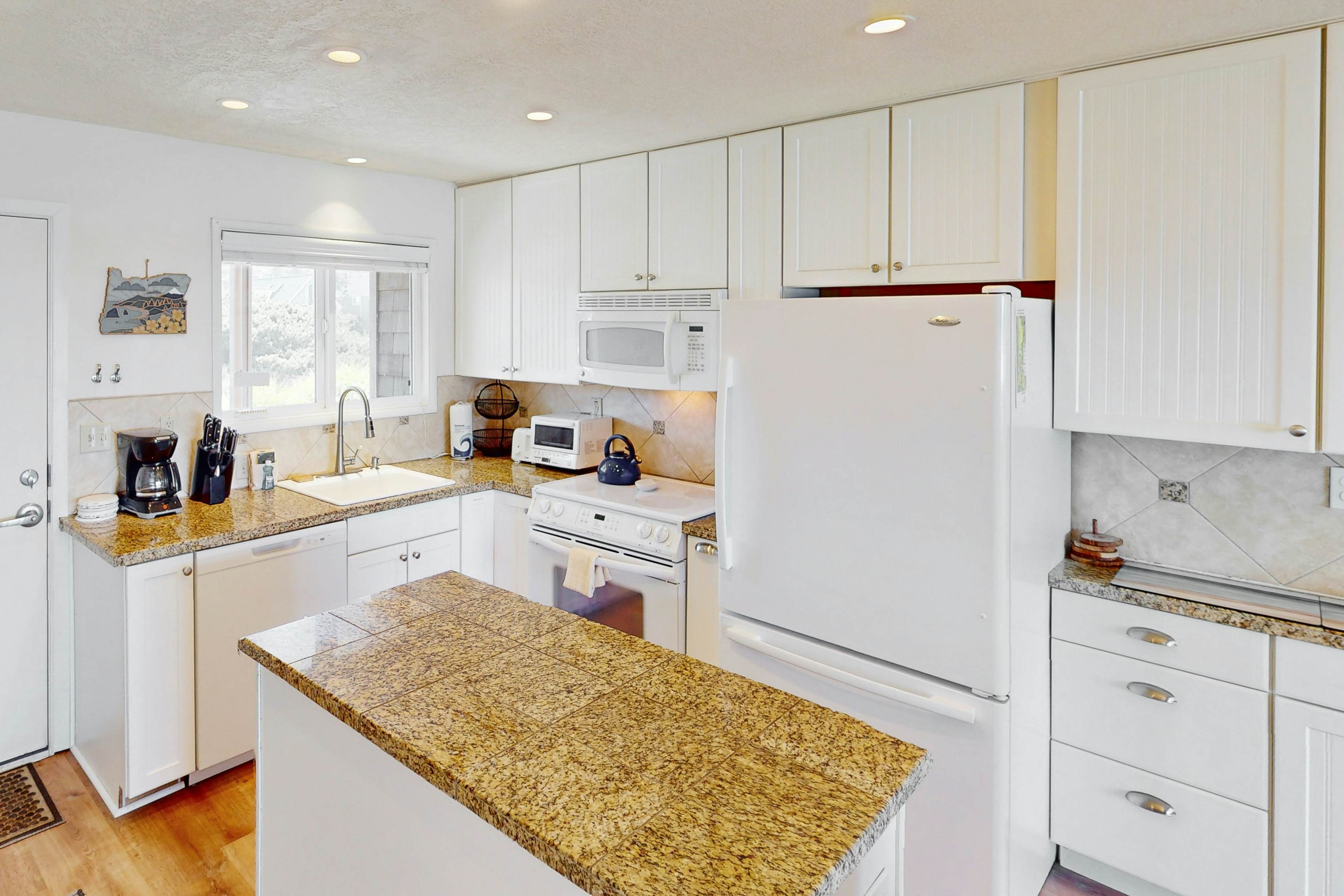 Beautiful ocean front condo with stunning views, WiFi, steps to beach