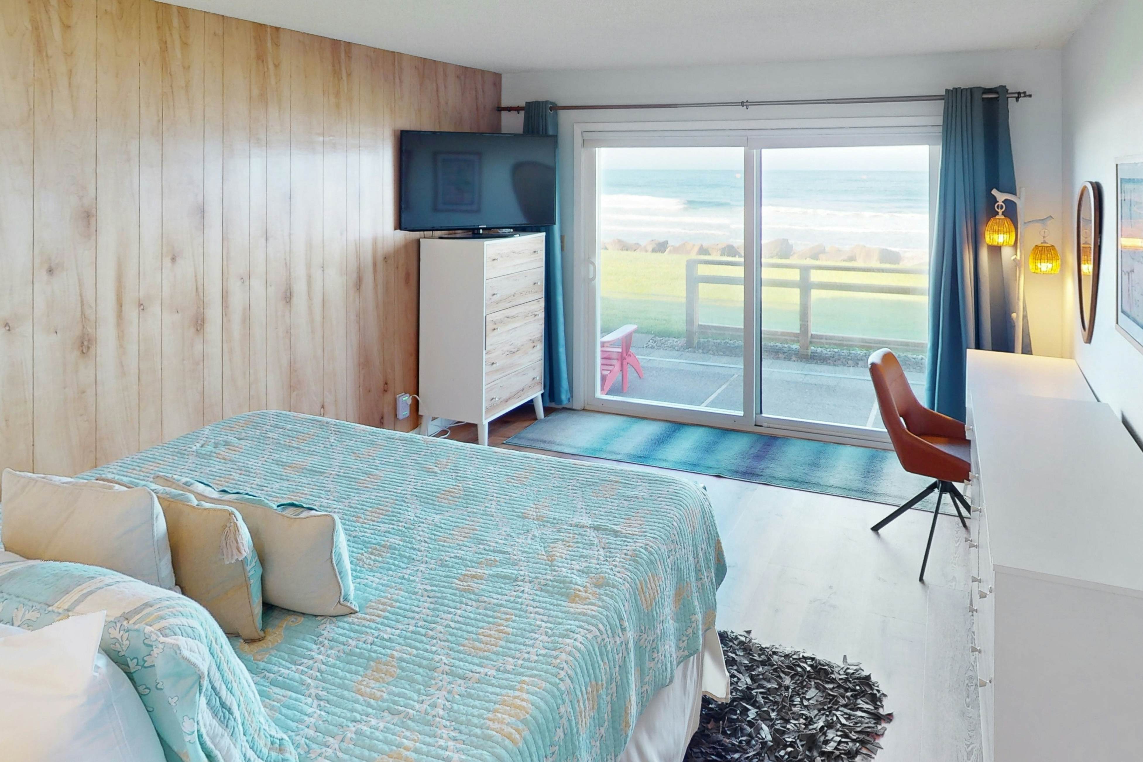 Beautiful ocean front condo with stunning views, WiFi, steps to beach