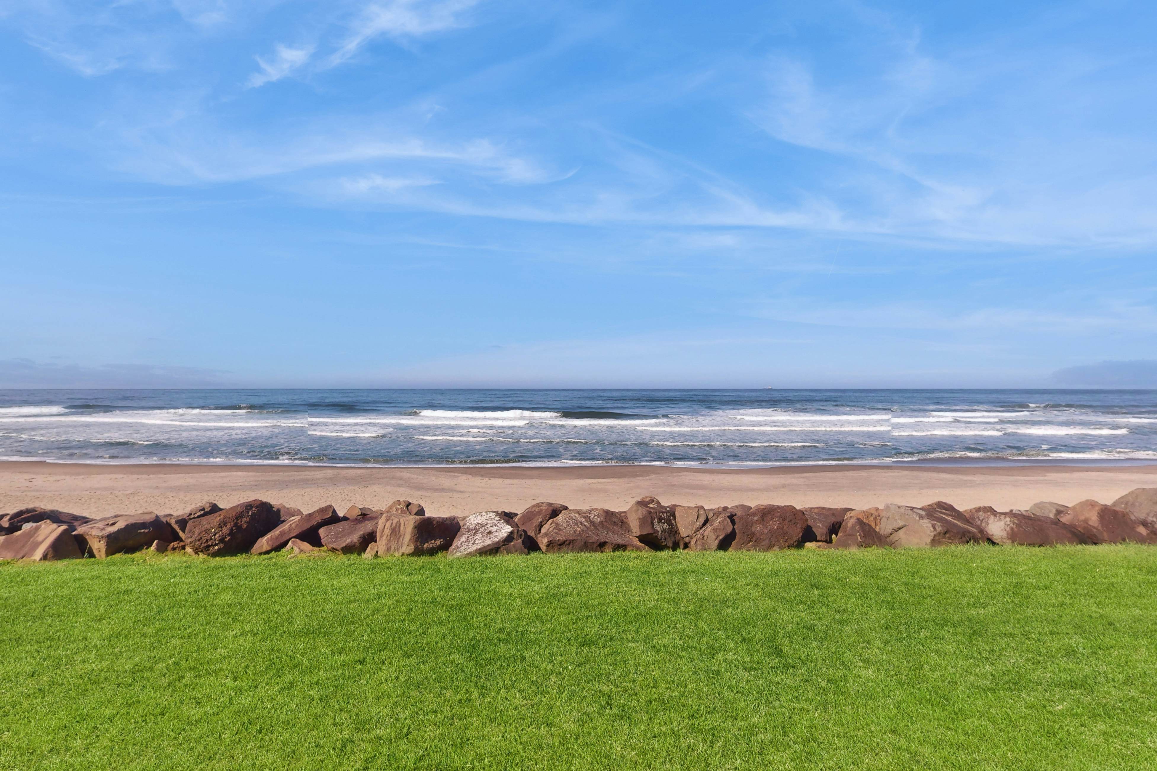 Beautiful ocean front condo with stunning views, WiFi, steps to beach