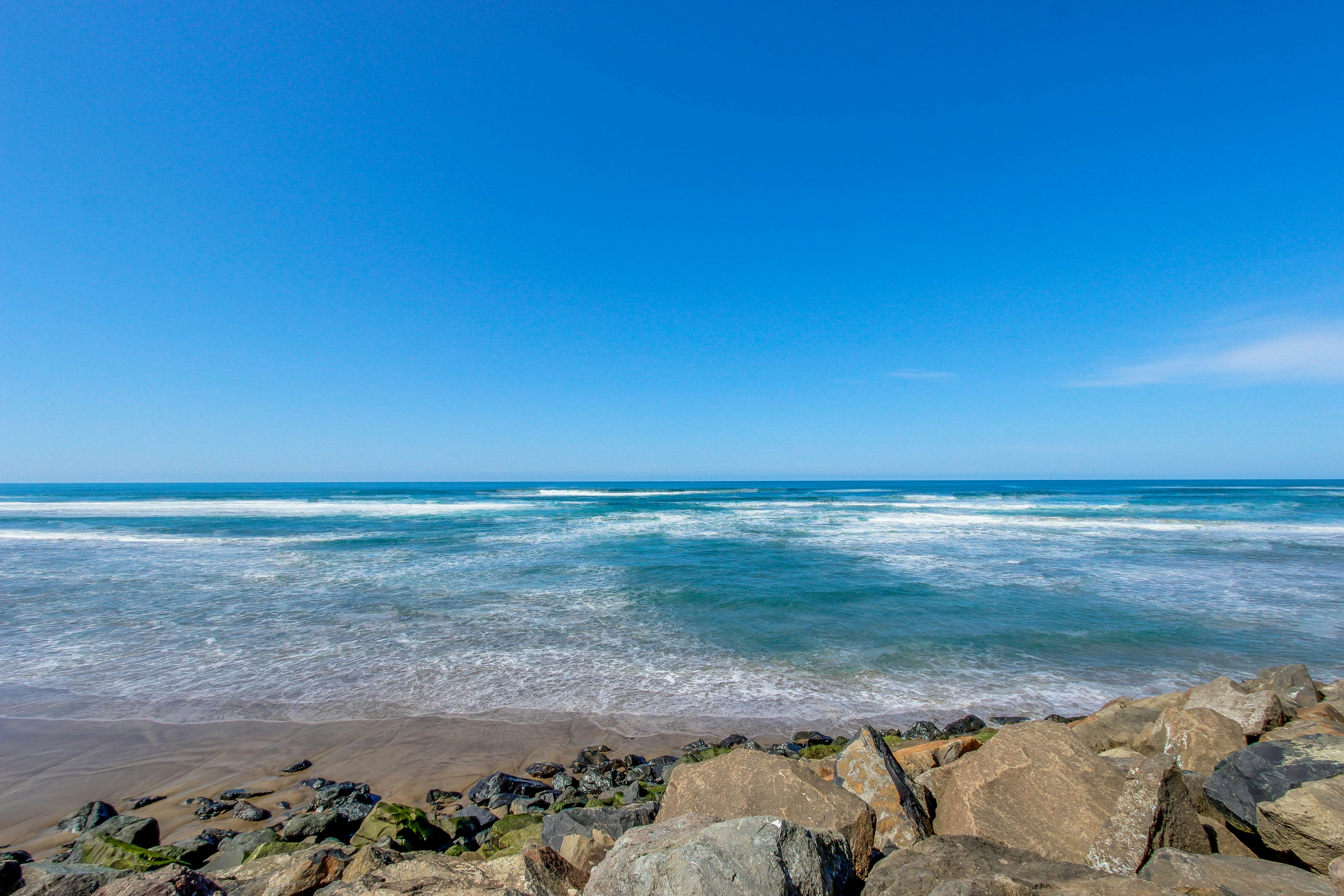 Beautiful ocean front condo with stunning views, WiFi, steps to beach