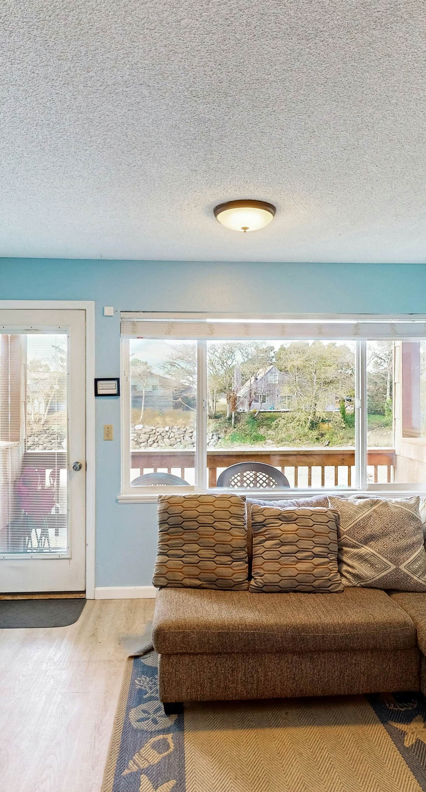 Creekside condo with beach access balcony full kitchen and ocean views