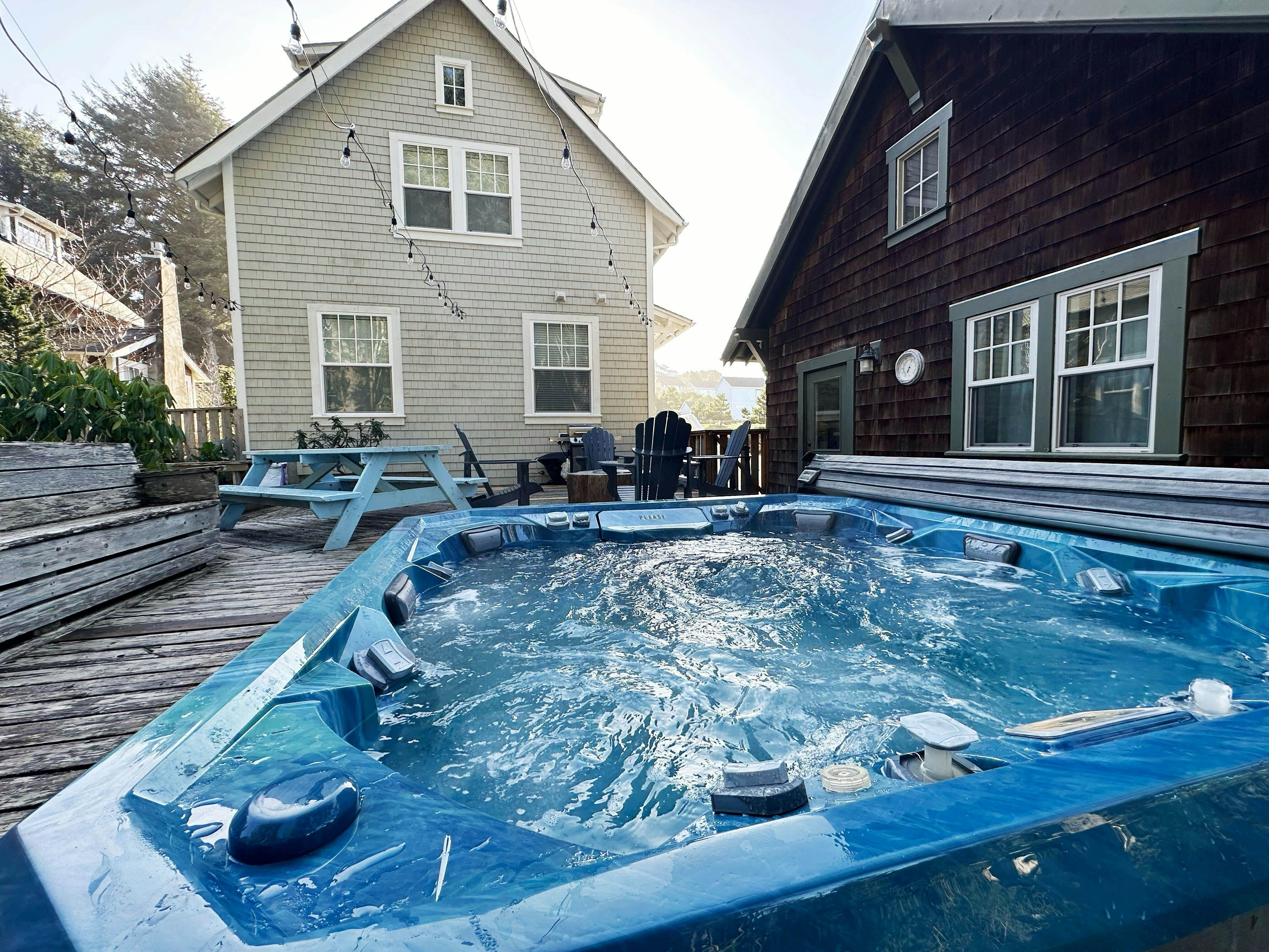 Beautiful home with peek a boo beach views patio with hot tub and firepit WiFi